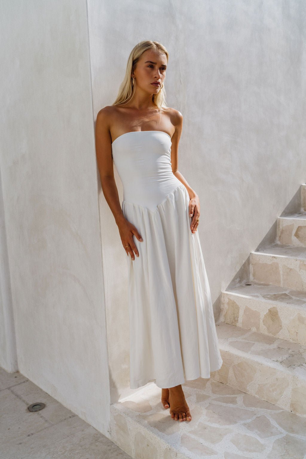 This is an image of Mackenzie Dress in White Linen - RESA featuring a model wearing the dress