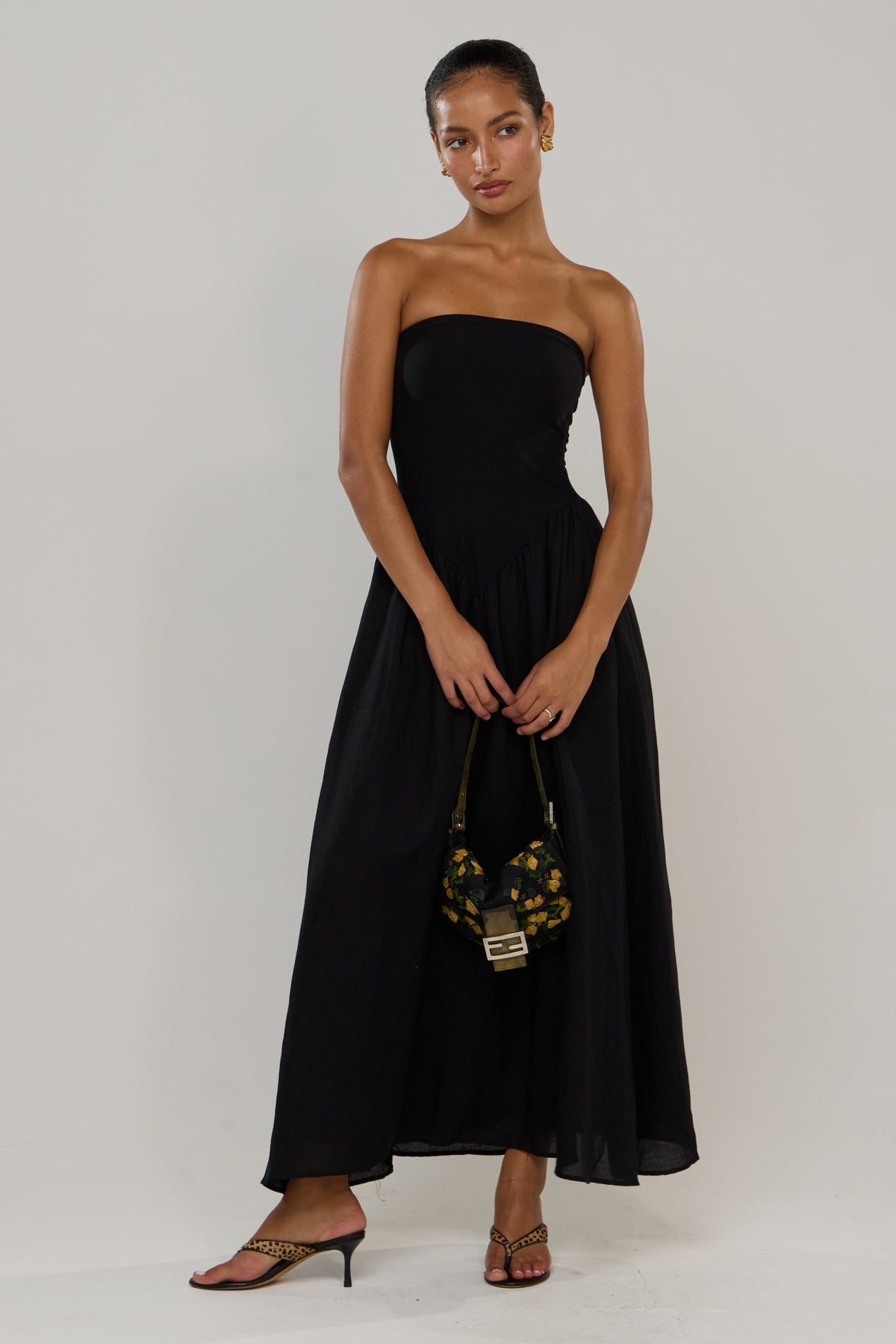This is an image of Mackenzie in Black Linen - RESA featuring a model wearing the dress