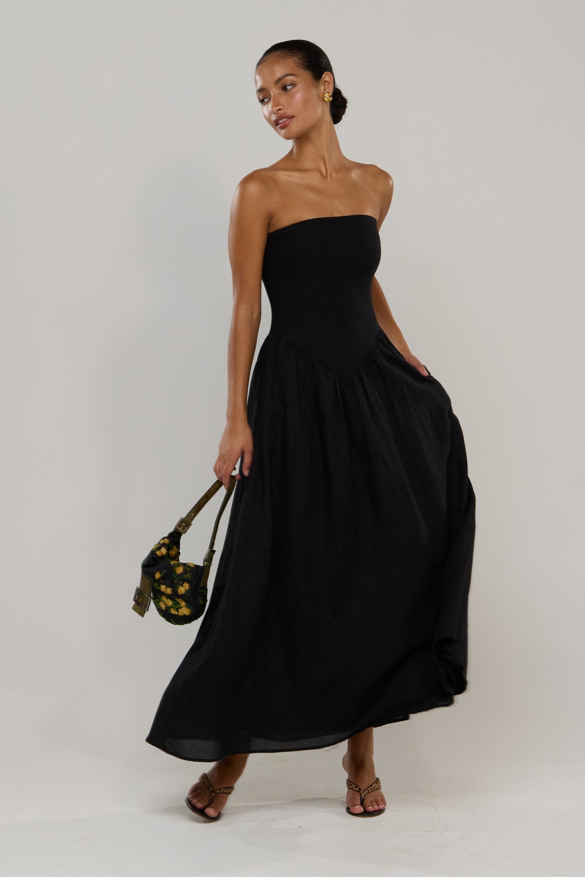 This is an image of Mackenzie in Black Linen - RESA featuring a model wearing the dress