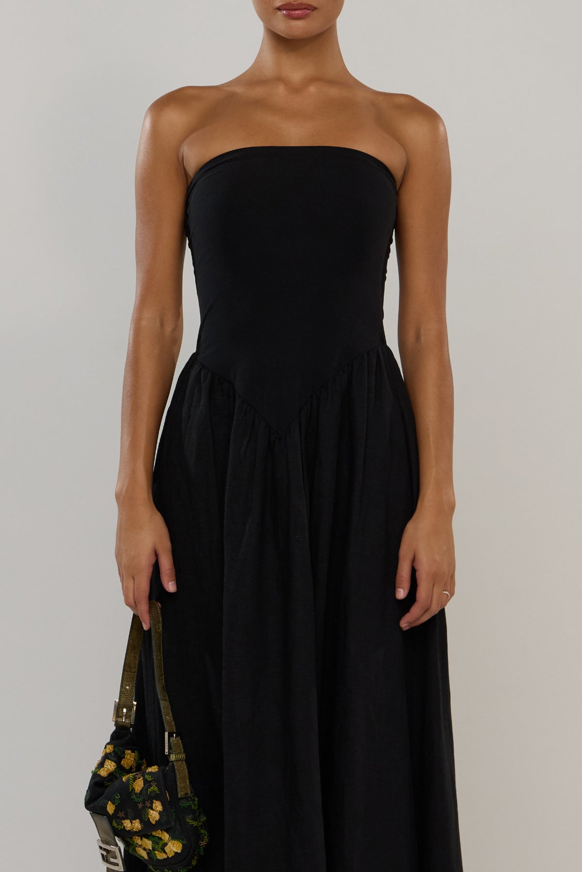 This is an image of Mackenzie in Black Linen - RESA featuring a model wearing the dress