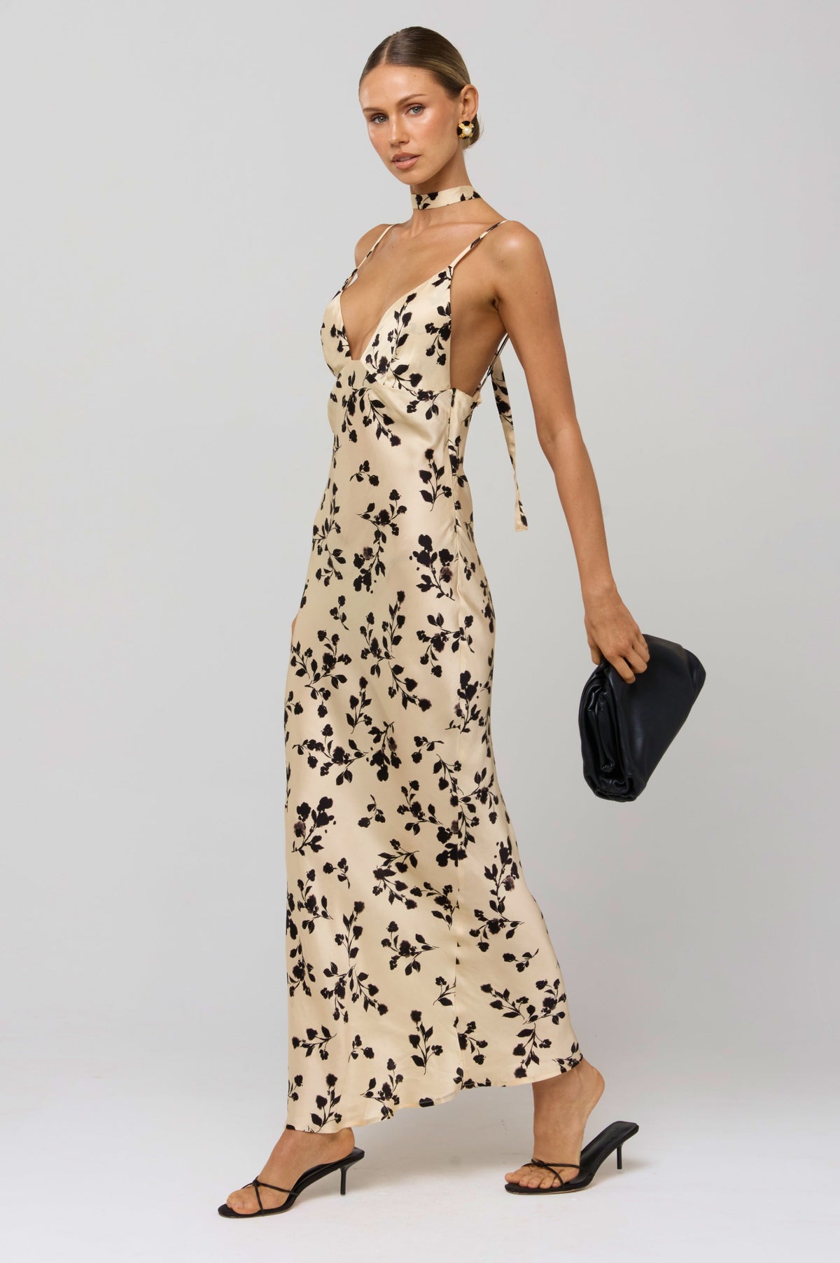 This is an image of Madeline Dress in Black Dahlia - RESA featuring a model wearing the dress