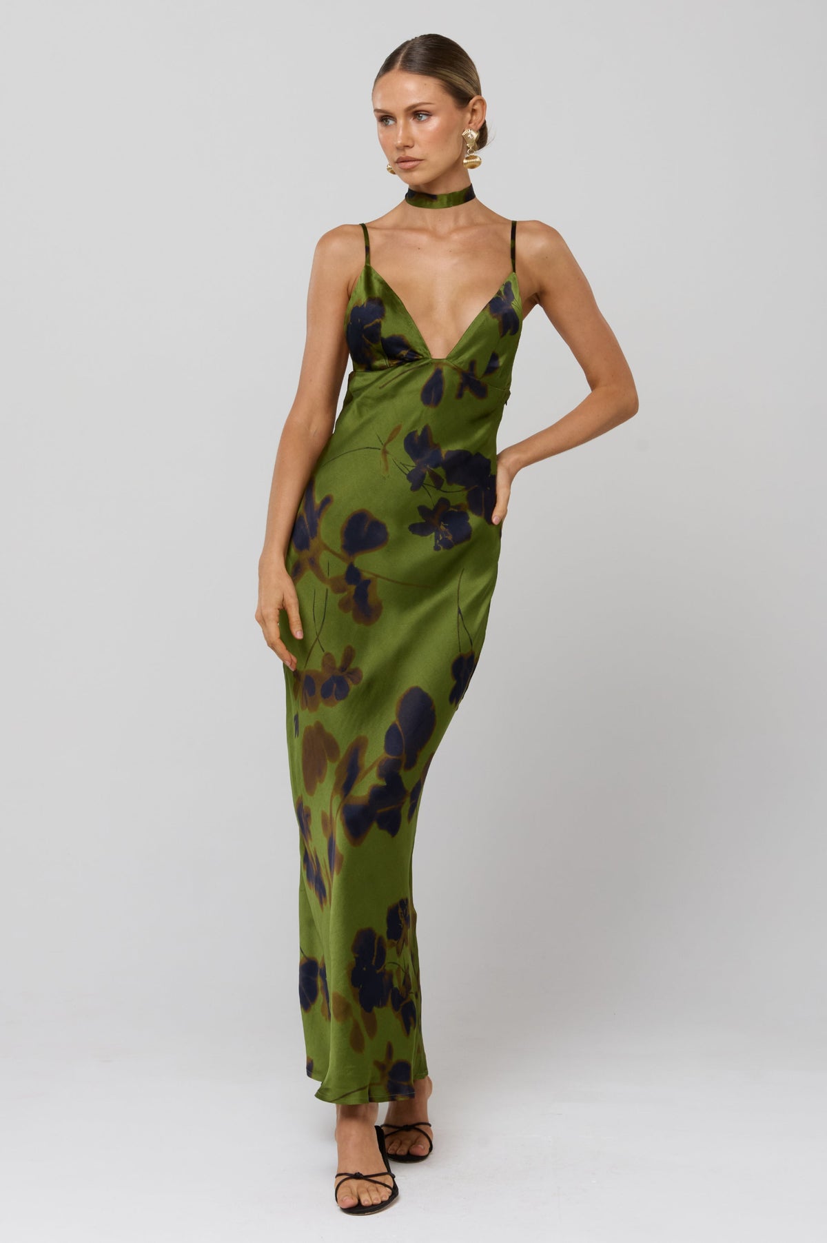 This is an image of Madeline Dress in Evergreen - RESA featuring a model wearing the dress