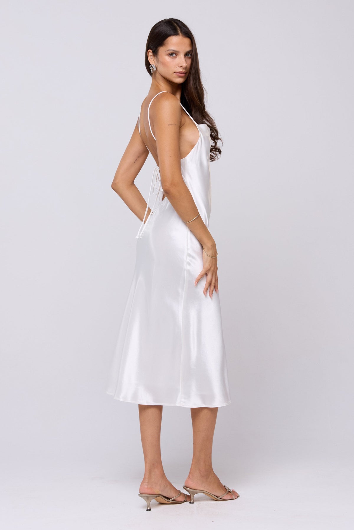 This is an image of Madison Slip in Pearl - RESA featuring a model wearing the dress