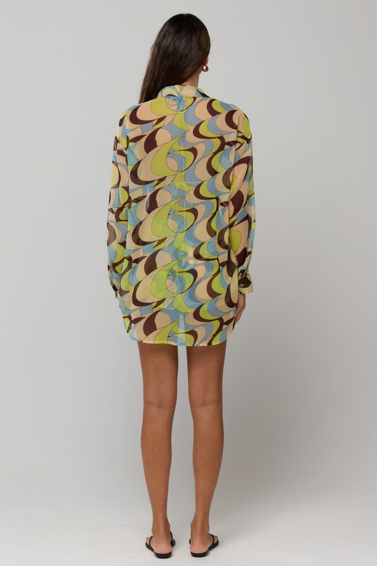 This is an image of Maggie set in Palm Royale - RESA featuring a model wearing the dress