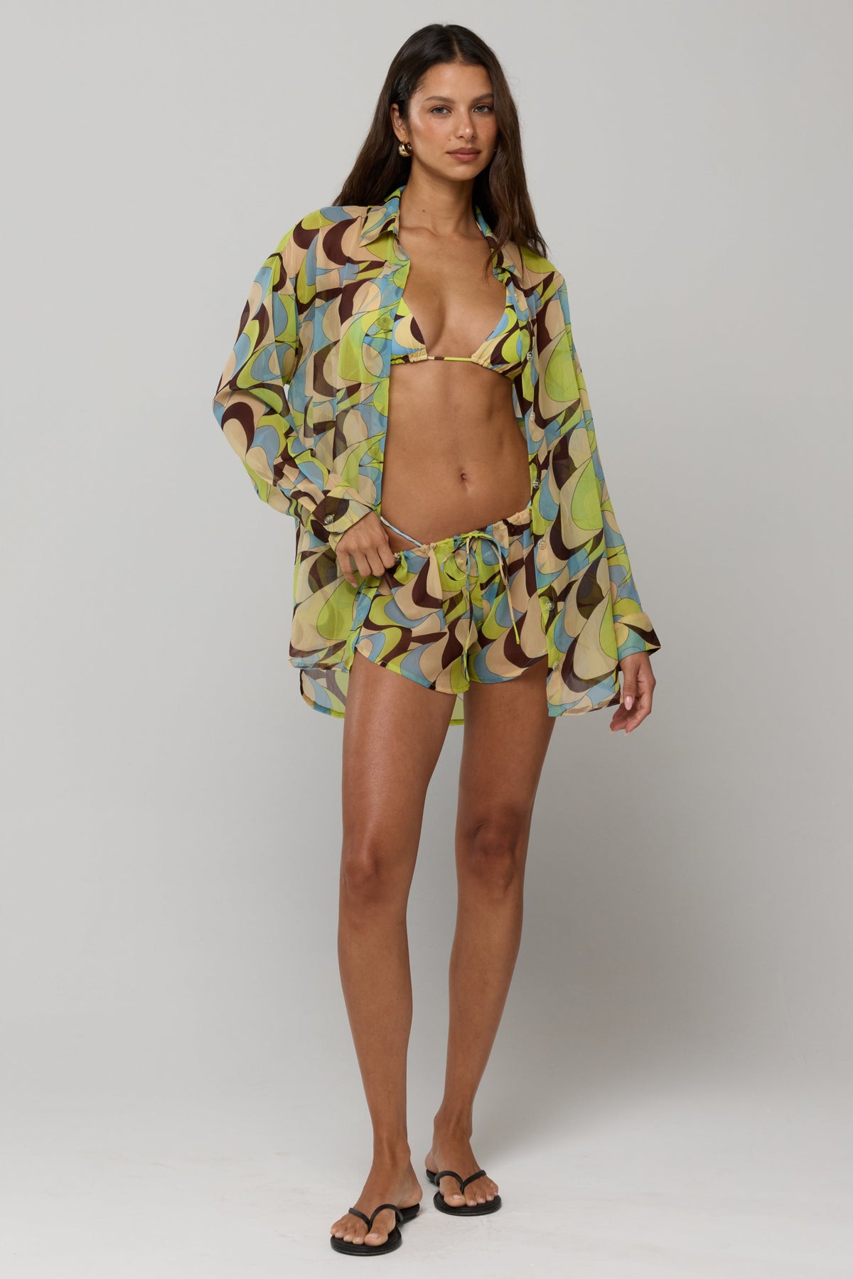 This is an image of Maggie set in Palm Royale - RESA featuring a model wearing the dress