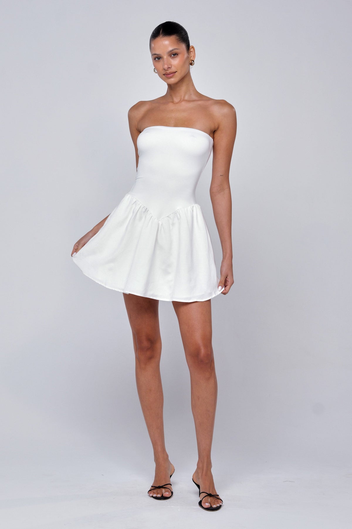 This is an image of Makie Dress White Linen - RESA featuring a model wearing the dress