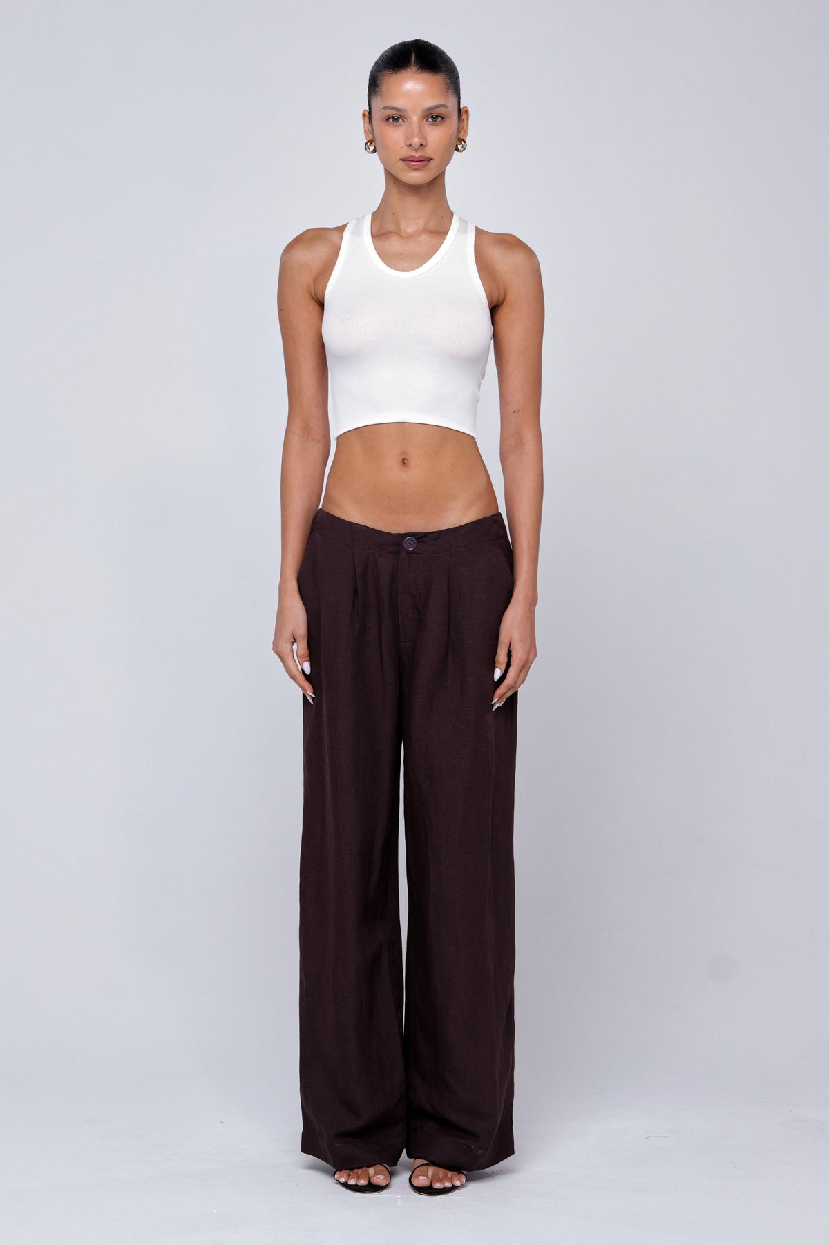 This is an image of Malcolm Trousers in Brown Linen - RESA featuring a model wearing the dress