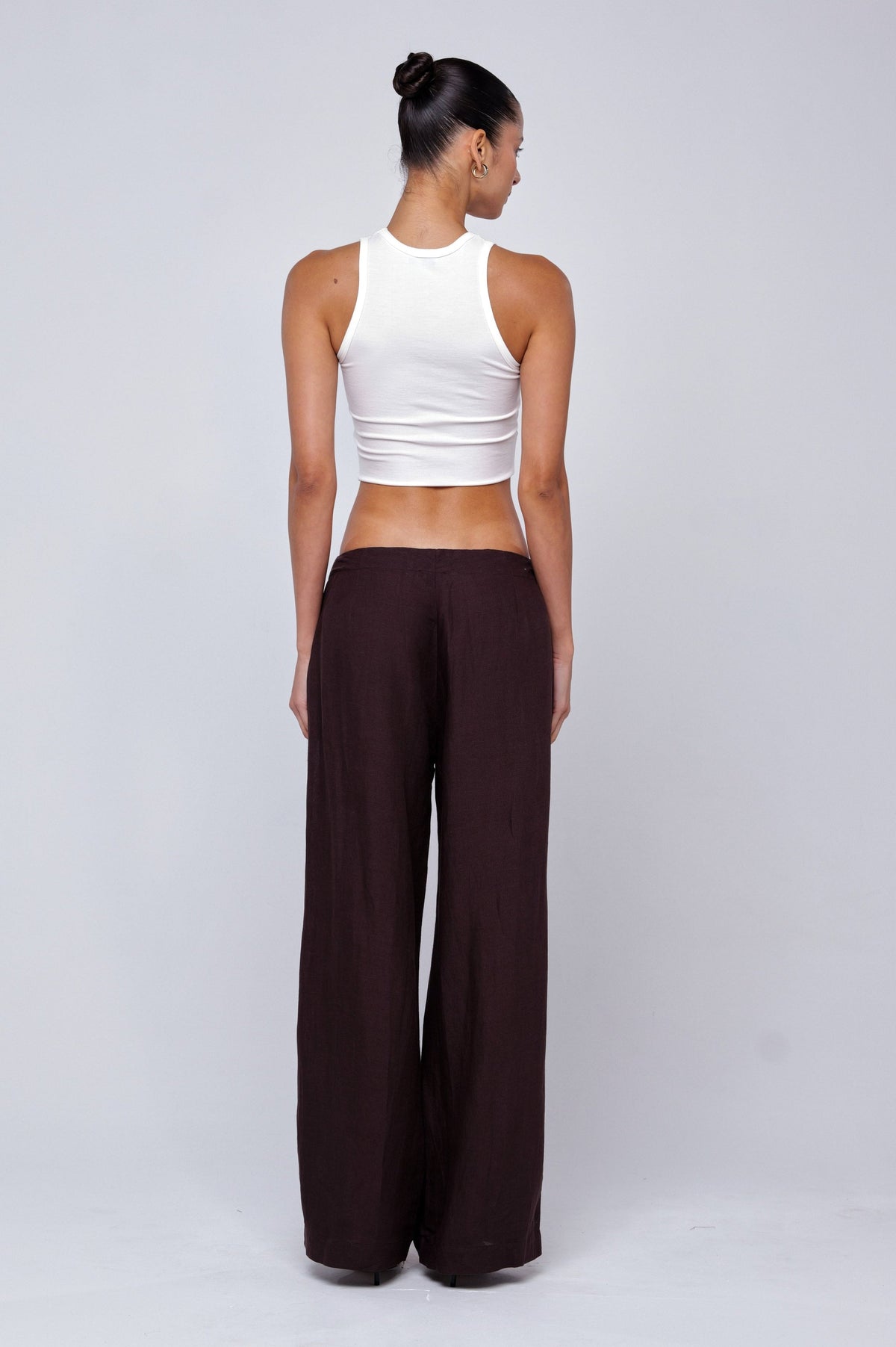 This is an image of Malcolm Trousers in Brown Linen - RESA featuring a model wearing the dress