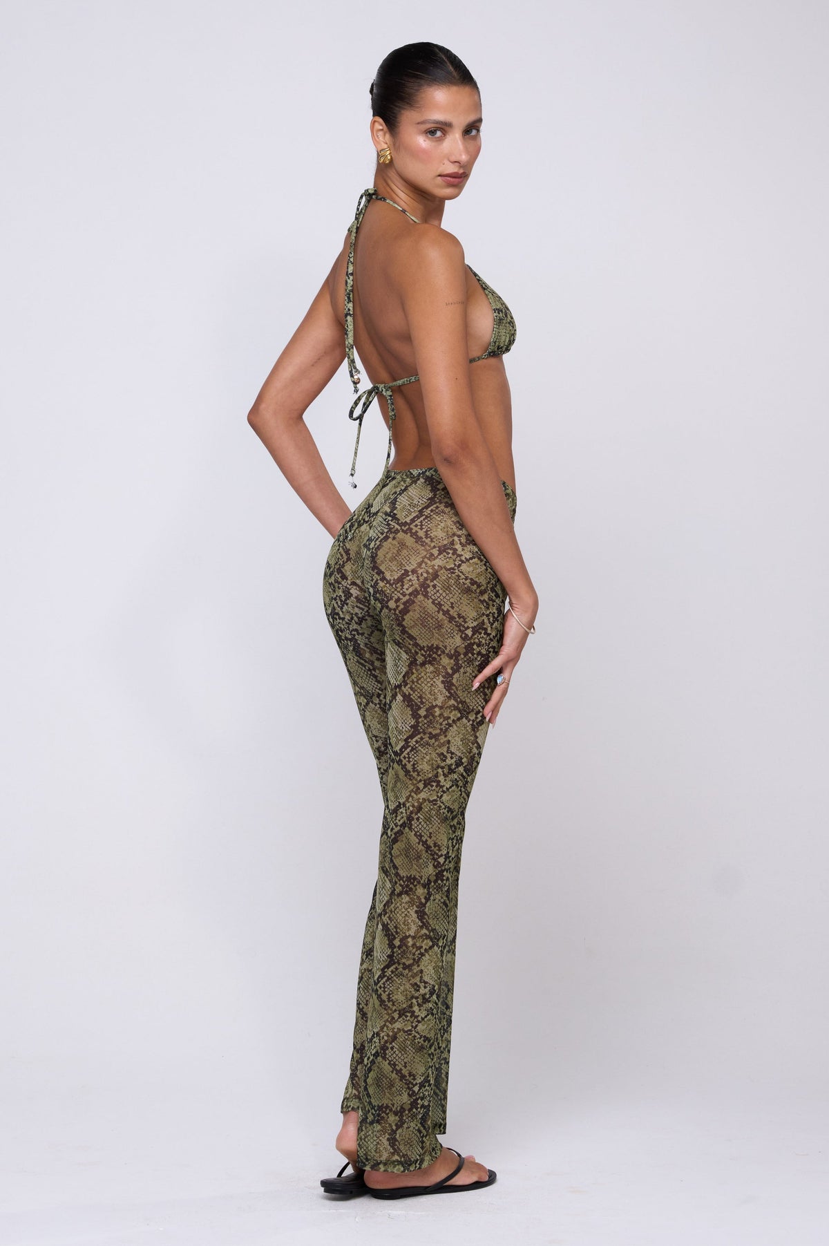 This is an image of Mallory Pant in Venom - RESA featuring a model wearing the dress