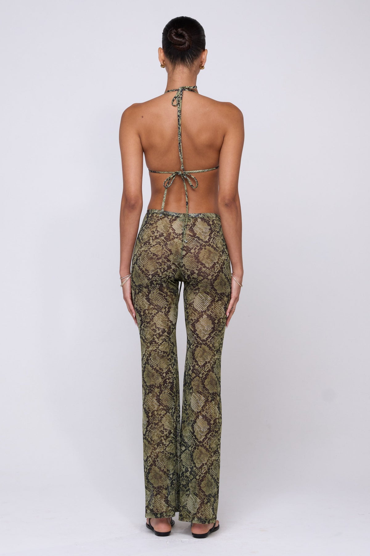 This is an image of Mallory Pant in Venom - RESA featuring a model wearing the dress