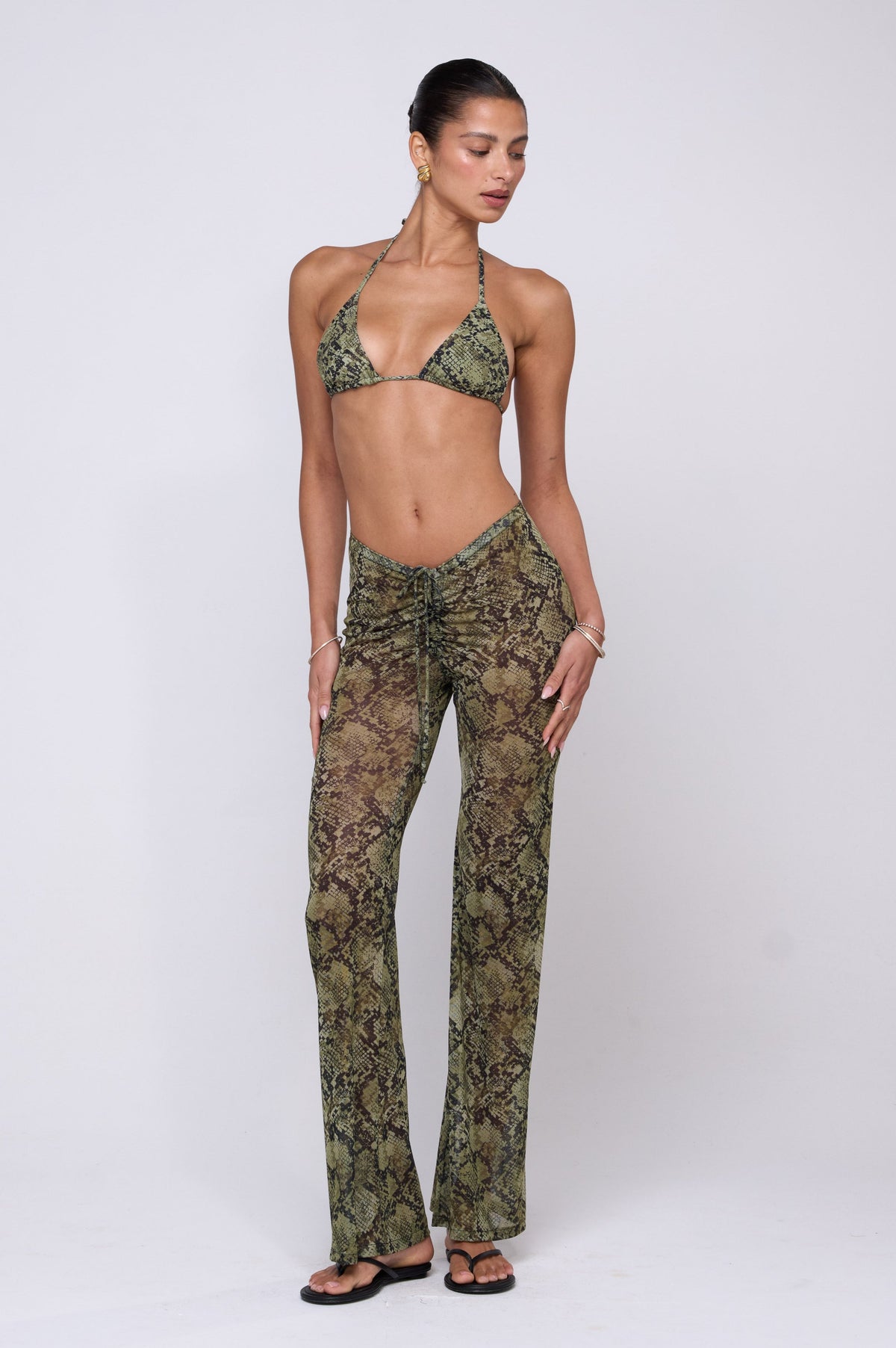 This is an image of Mallory Pant in Venom - RESA featuring a model wearing the dress