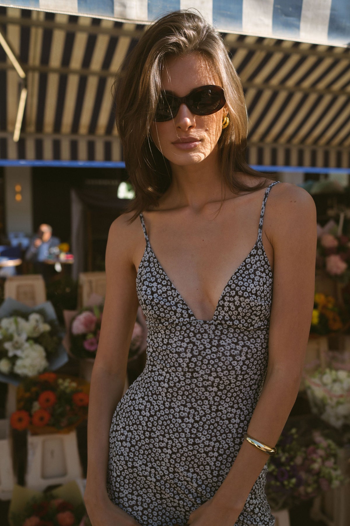 This is an image of Matilda Midi Dress in Flores - RESA featuring a model wearing the dress