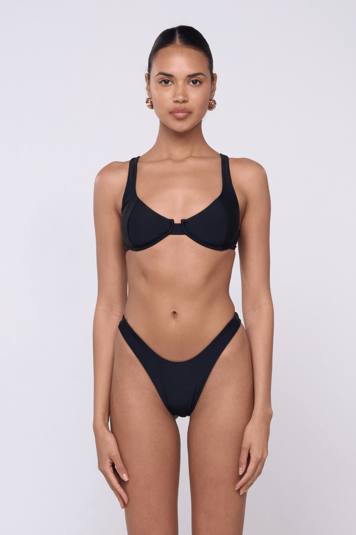 This is an image of Matty Bikini Top in Black - RESA featuring a model wearing the dress