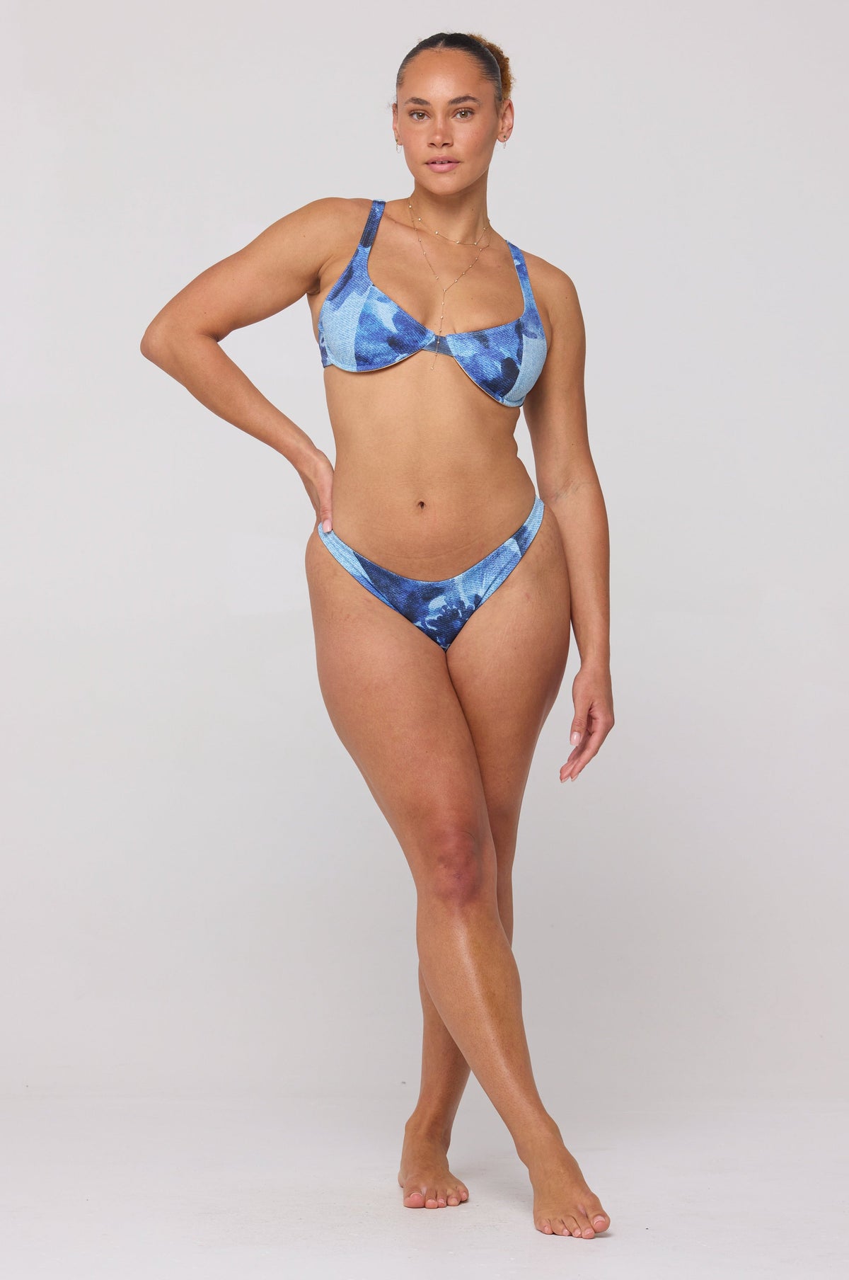 This is an image of Matty Bikini Top in Indigo - RESA featuring a model wearing the dress