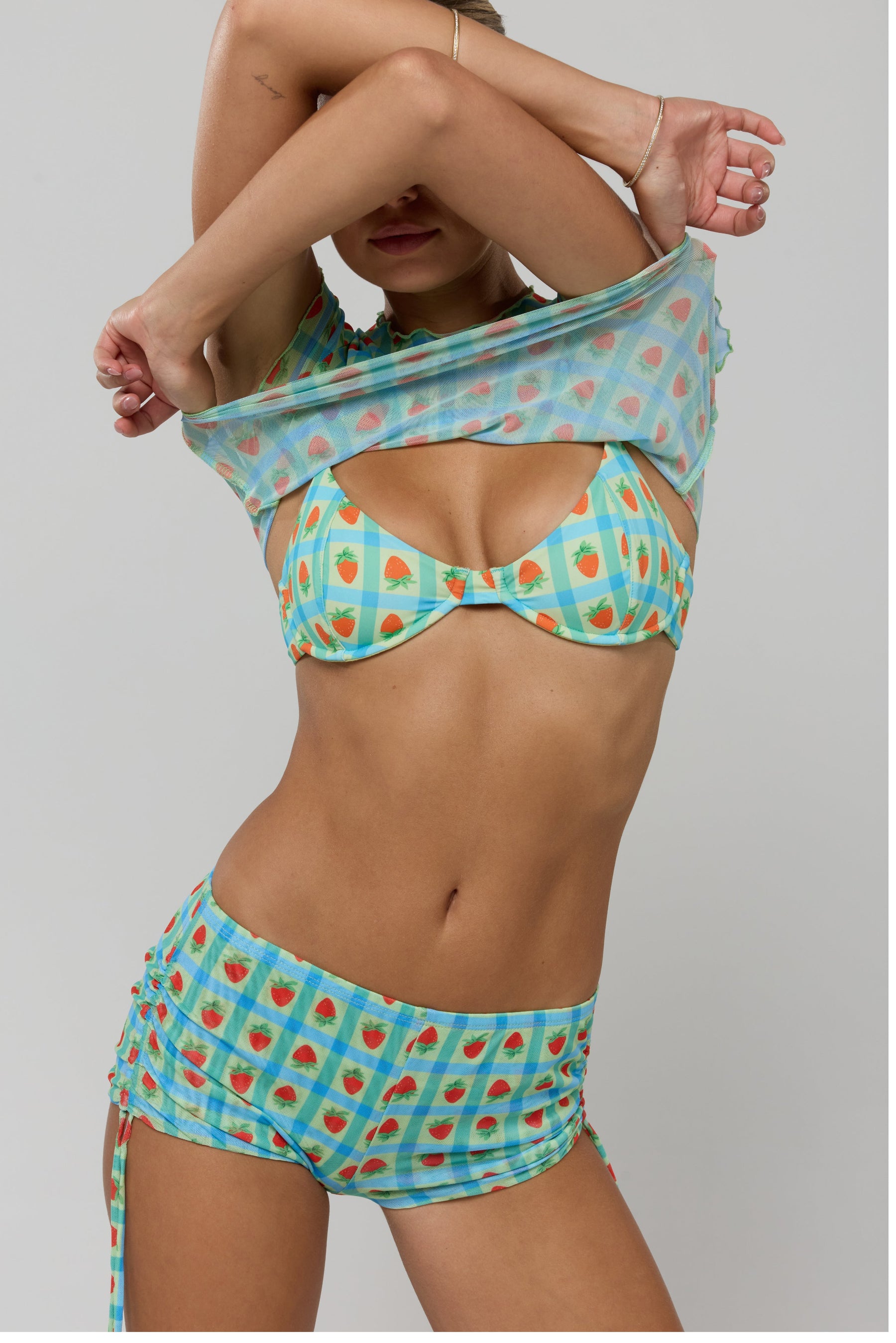 This is an image of Matty Bikini Top in Juicy - RESA featuring a model wearing the dress