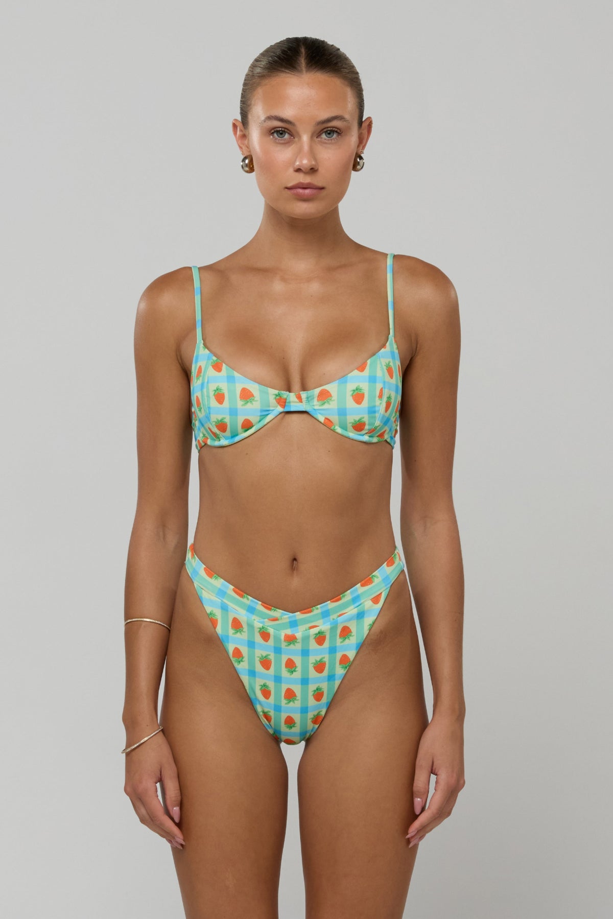 This is an image of Matty Bikini Top in Juicy - RESA featuring a model wearing the dress
