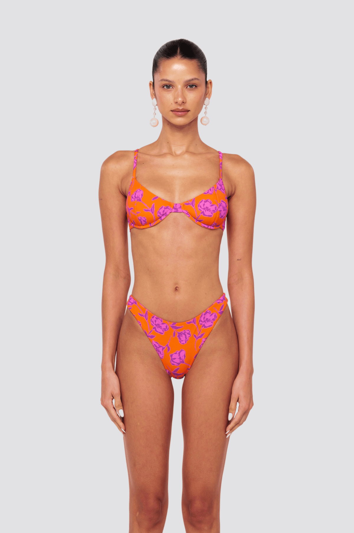 This is an image of Matty Bikini Top in Mandarin - RESA featuring a model wearing the dress