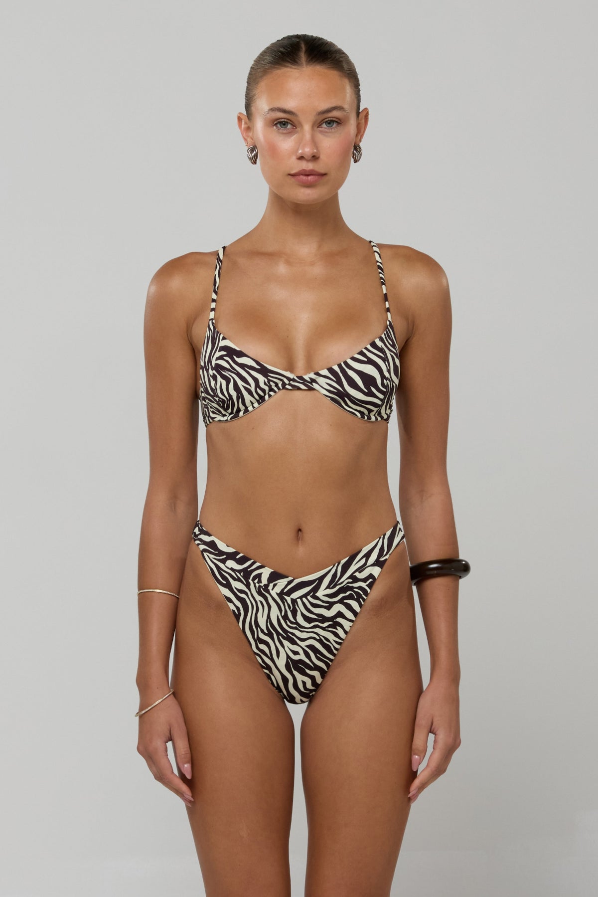 This is an image of Matty Bikini Top in Selva - RESA featuring a model wearing the dress