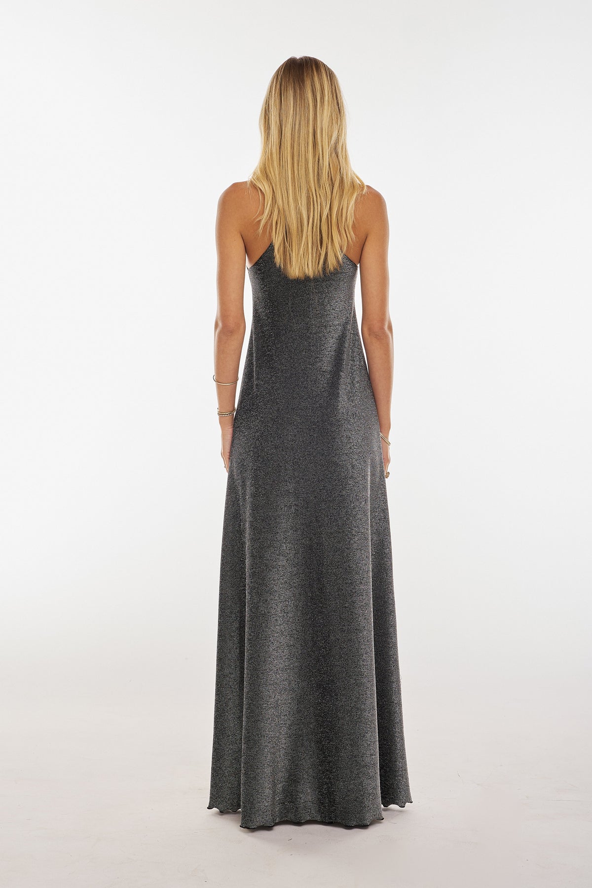 This is an image of Maxine Maxi in Graphite - RESA featuring a model wearing the dress