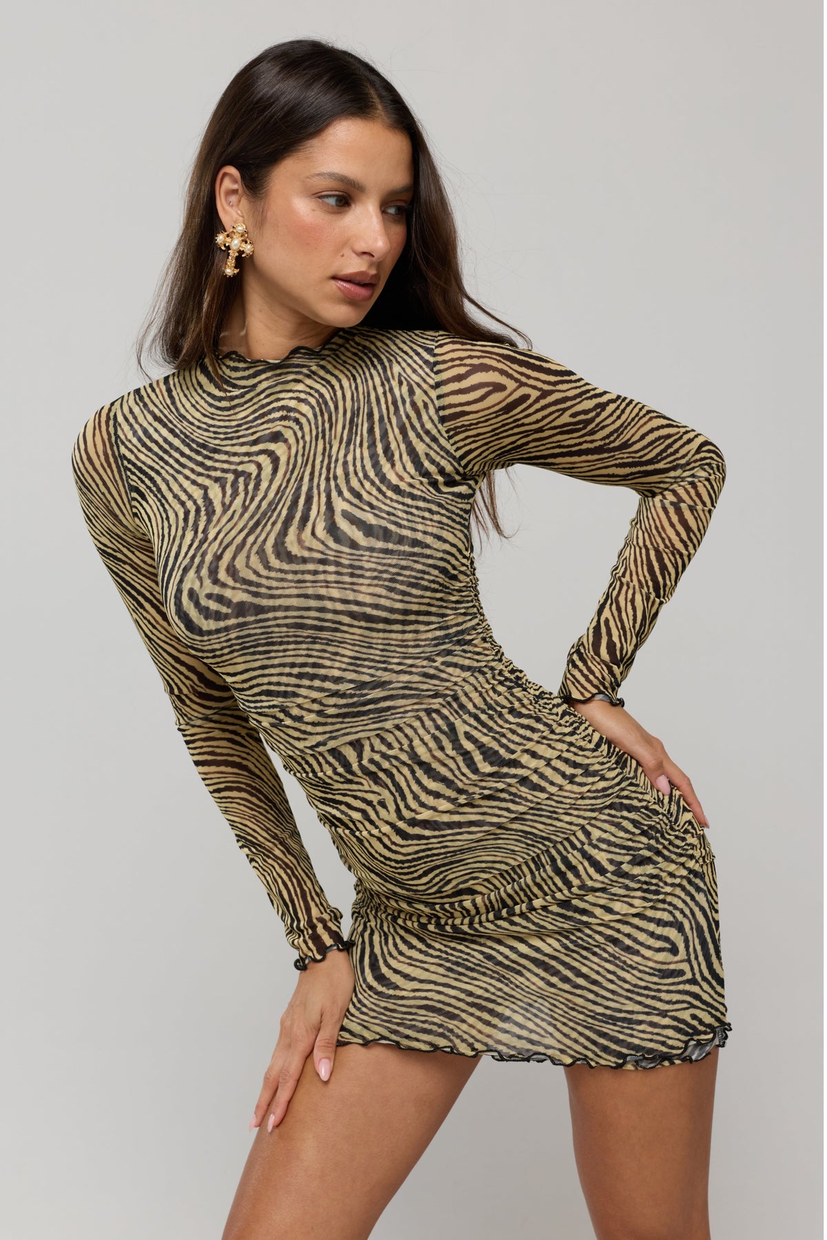 This is an image of Mecca Dress in Birch - RESA featuring a model wearing the dress