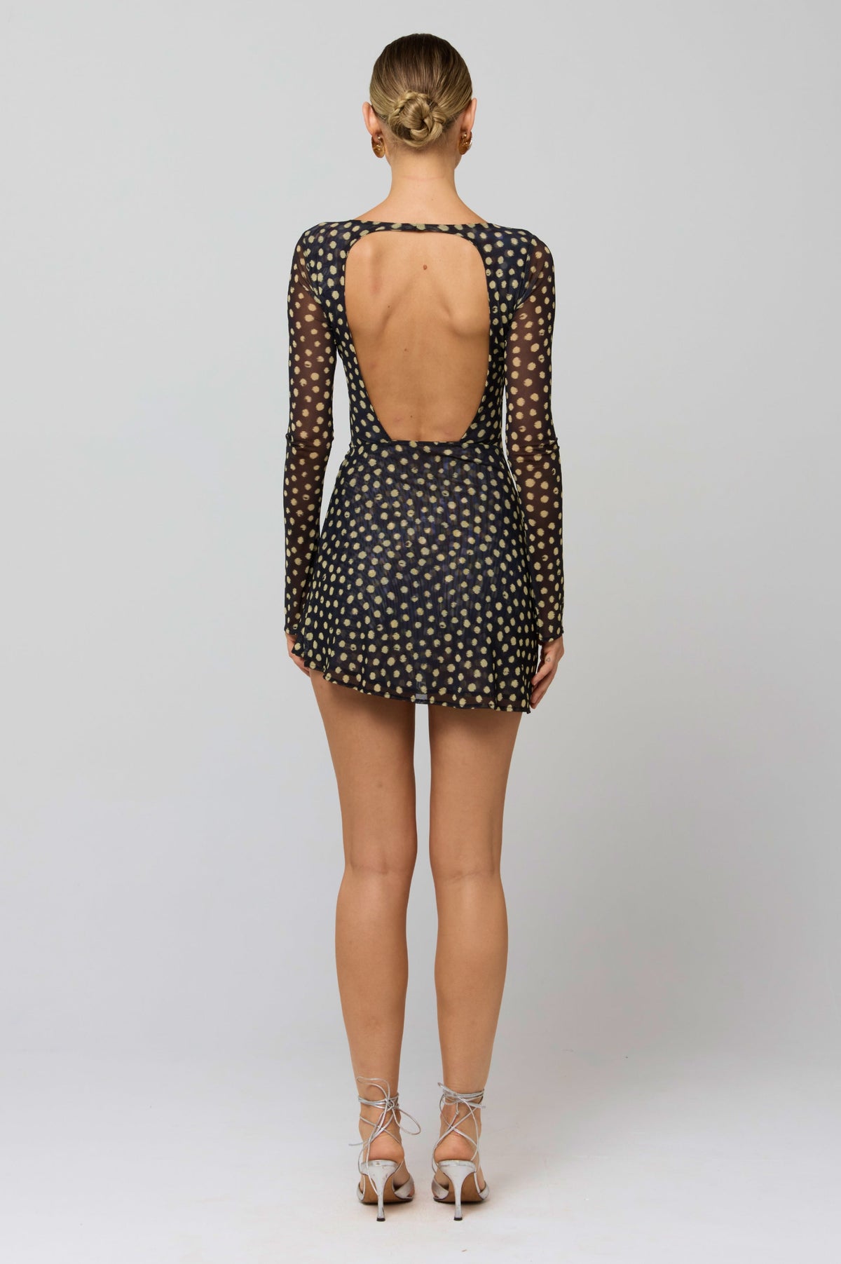 This is an image of Mia Mini Dress in Celeste - RESA featuring a model wearing the dress