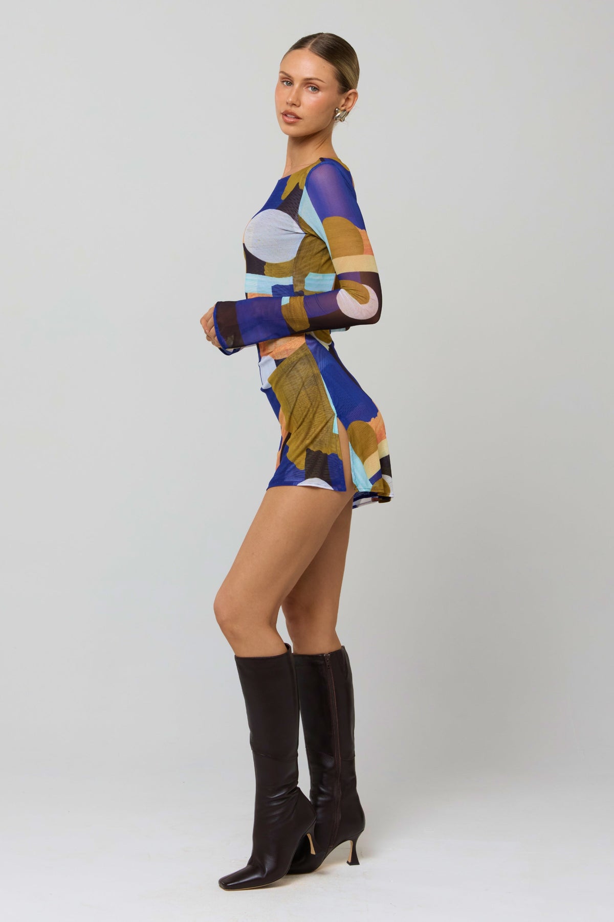 This is an image of Mia Mini Dress in Deco - RESA featuring a model wearing the dress