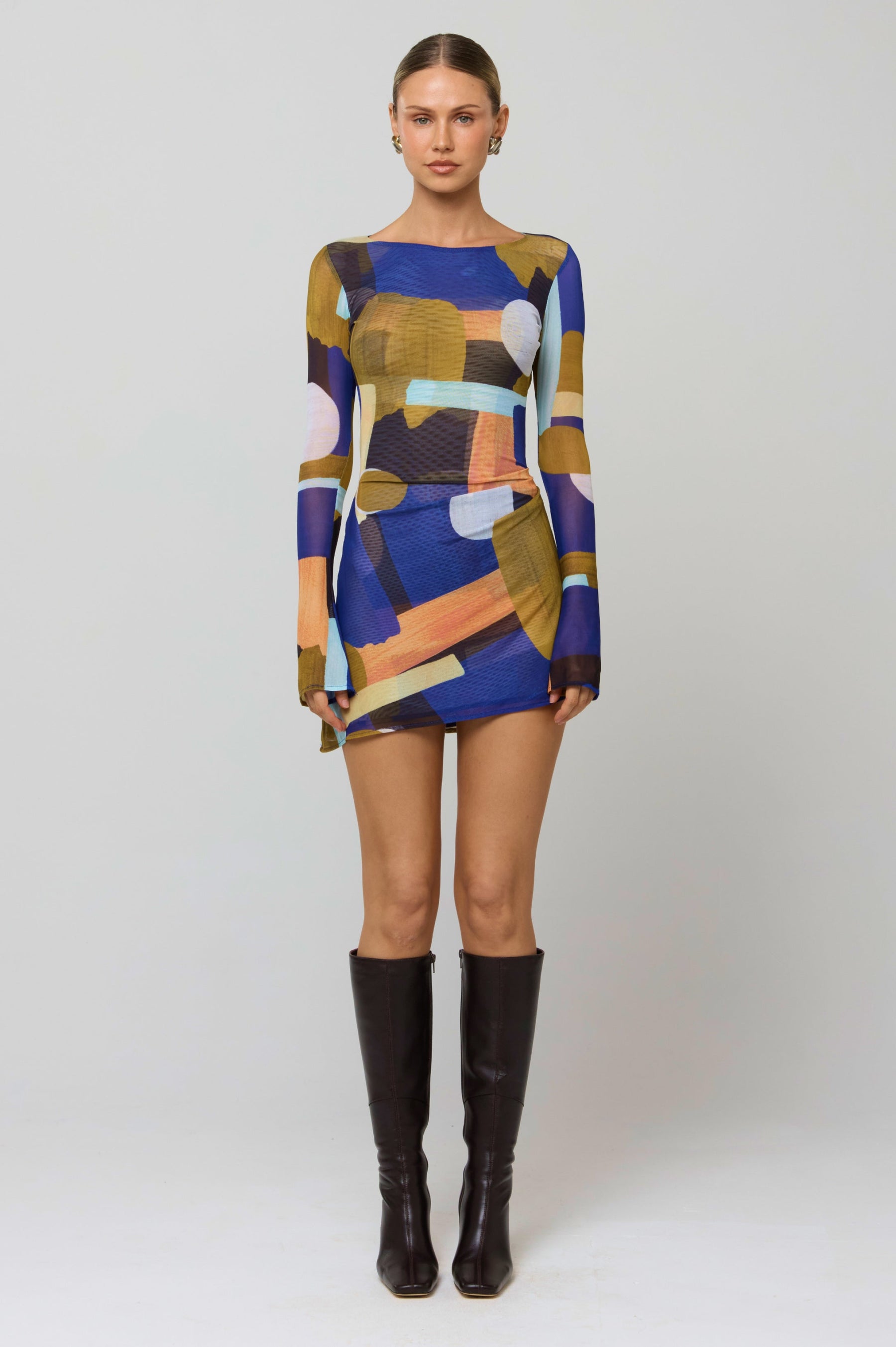 This is an image of Mia Mini Dress in Deco - RESA featuring a model wearing the dress