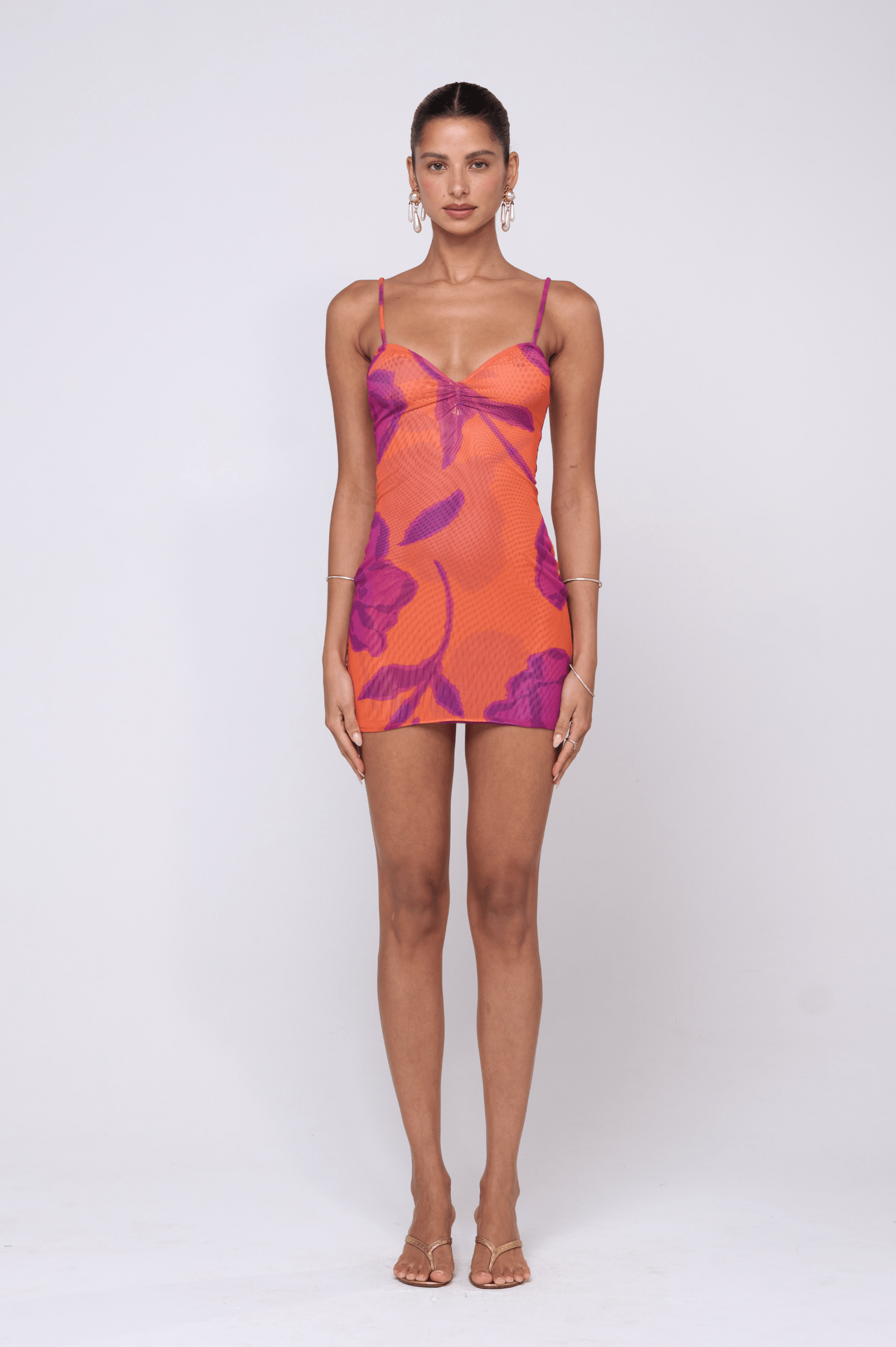 This is an image of Micro Mini Dress in Mandarin - RESA featuring a model wearing the dress