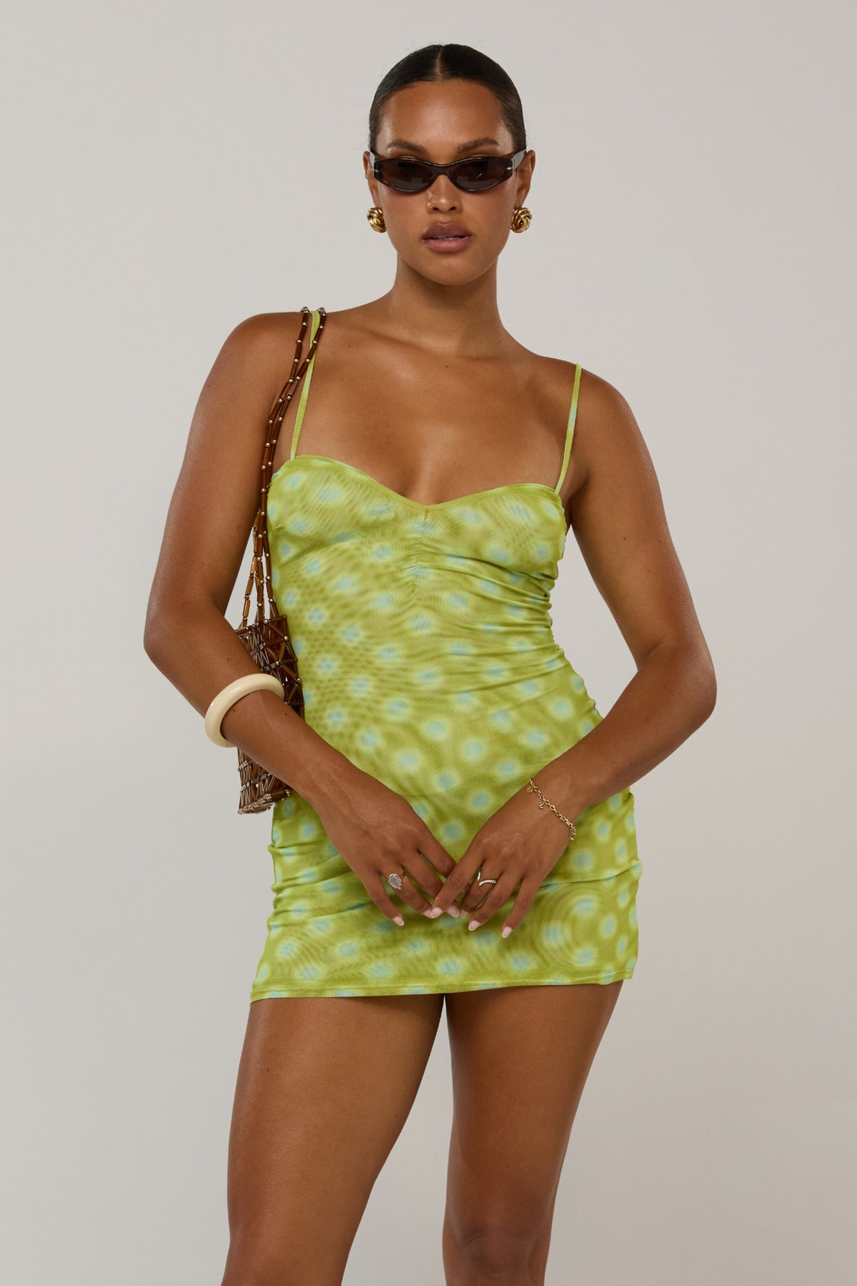 This is an image of Micro Mini in Luma - RESA featuring a model wearing the dress