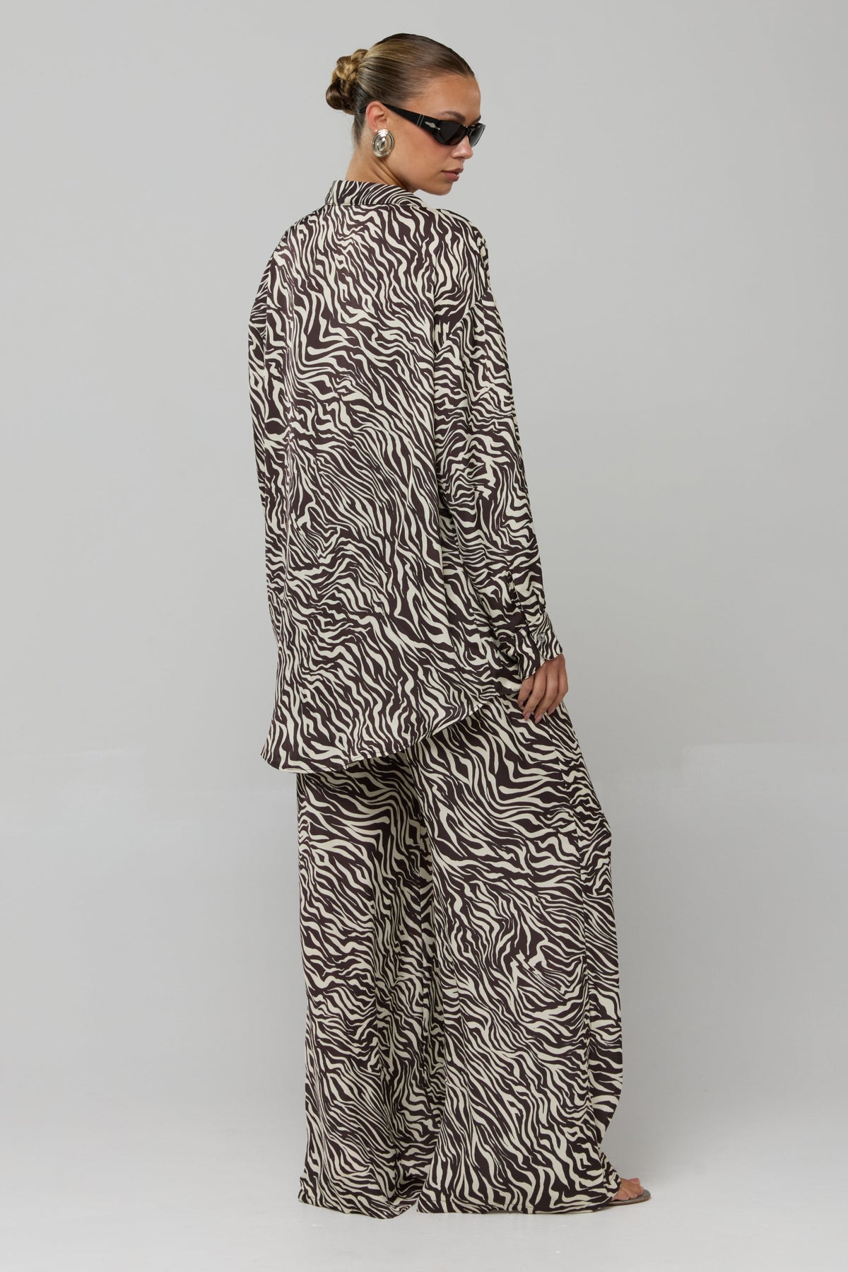 This is an image of Miley Set in Selva - RESA featuring a model wearing the dress
