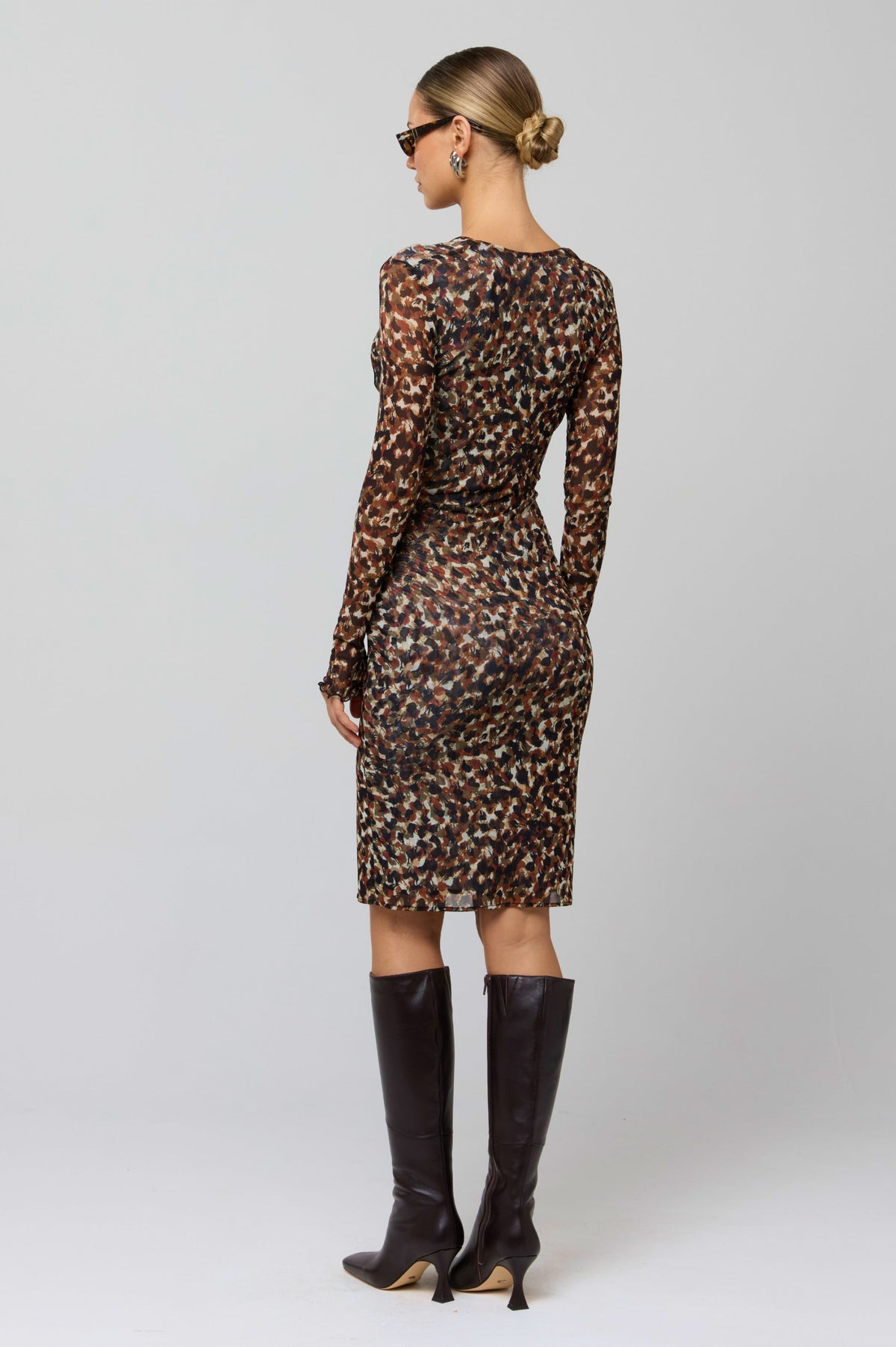 This is an image of Mira Dress in Terra - RESA featuring a model wearing the dress