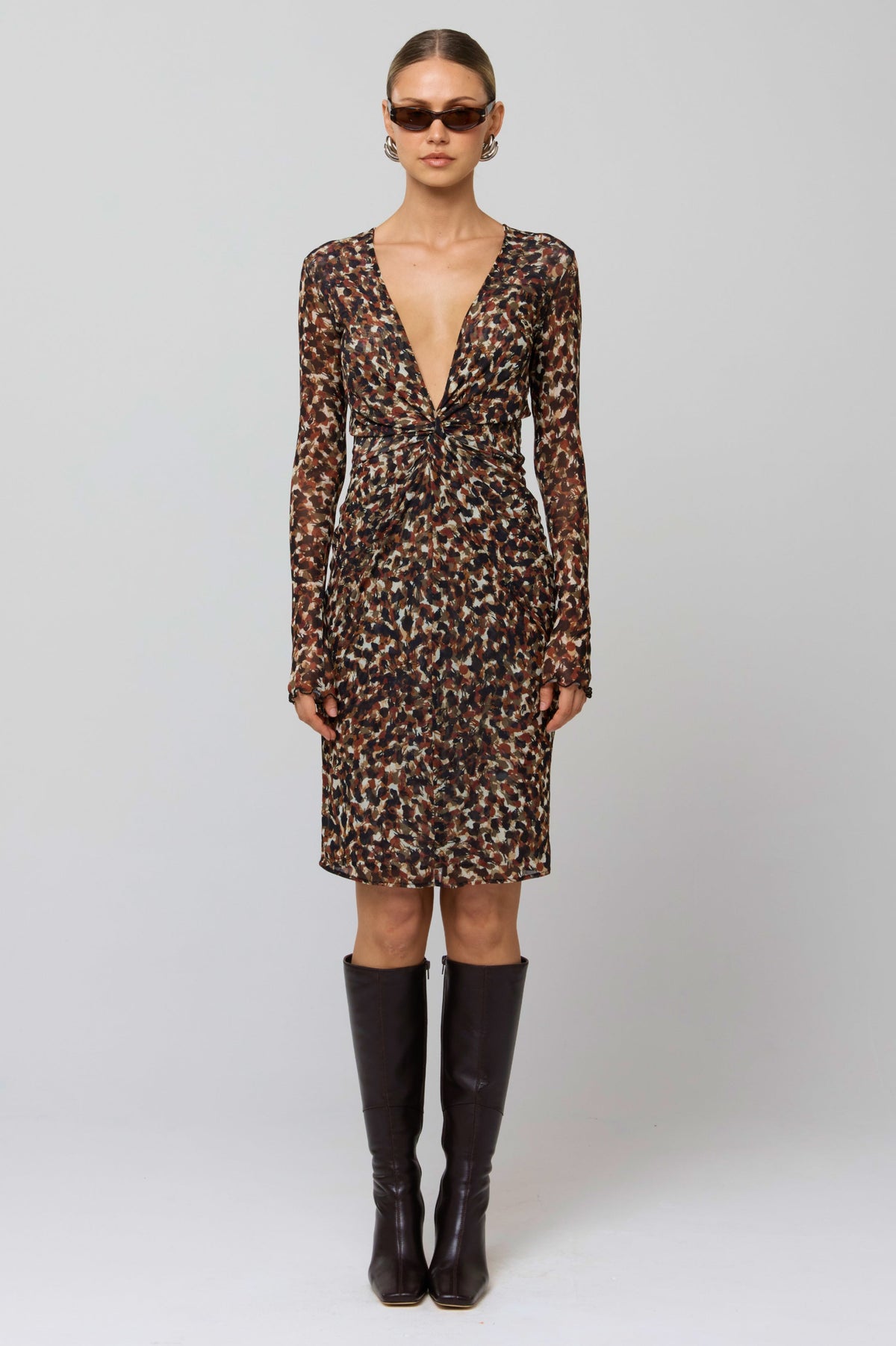 This is an image of Mira Dress in Terra - RESA featuring a model wearing the dress