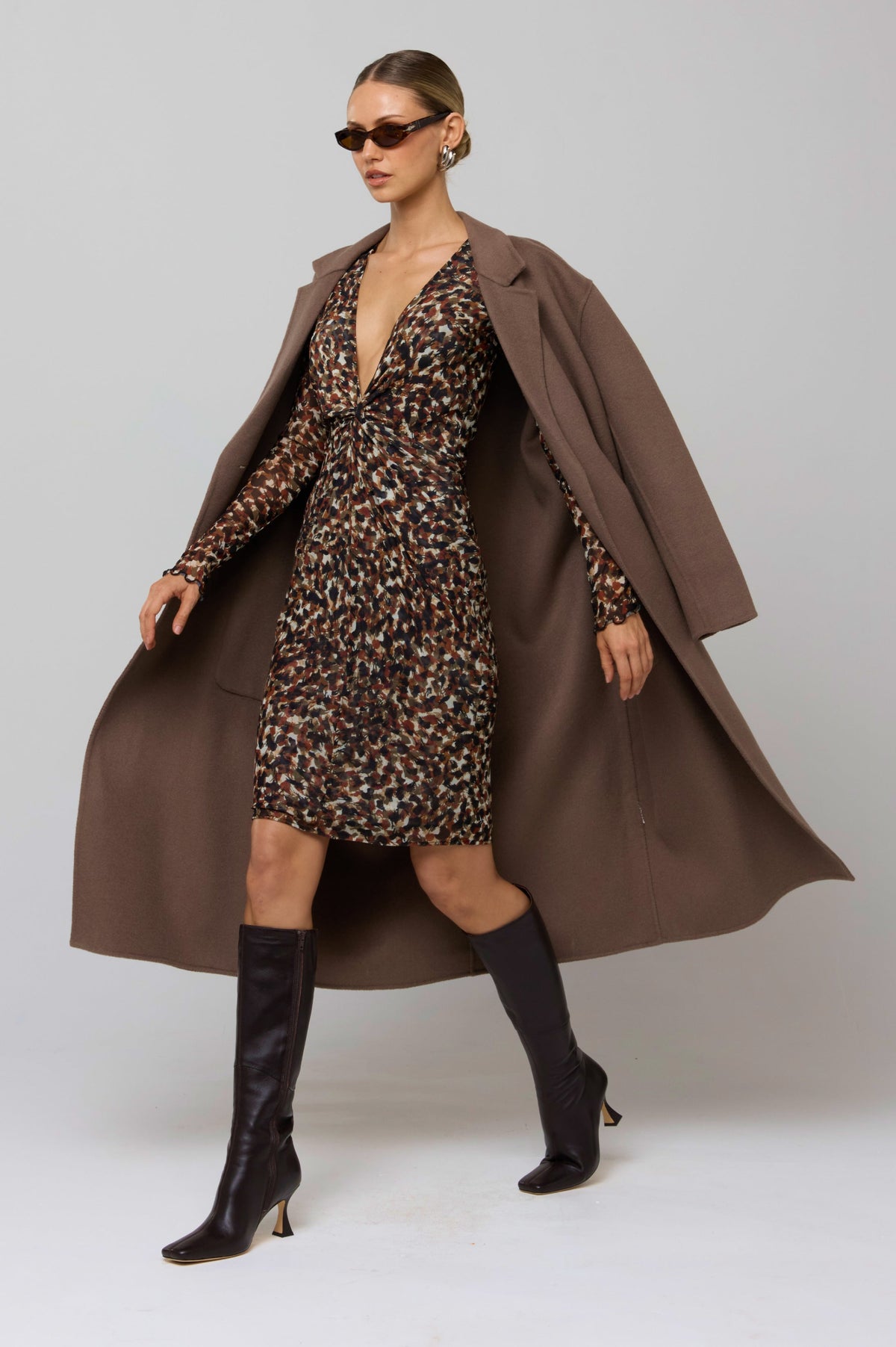 This is an image of Mira Dress in Terra - RESA featuring a model wearing the dress