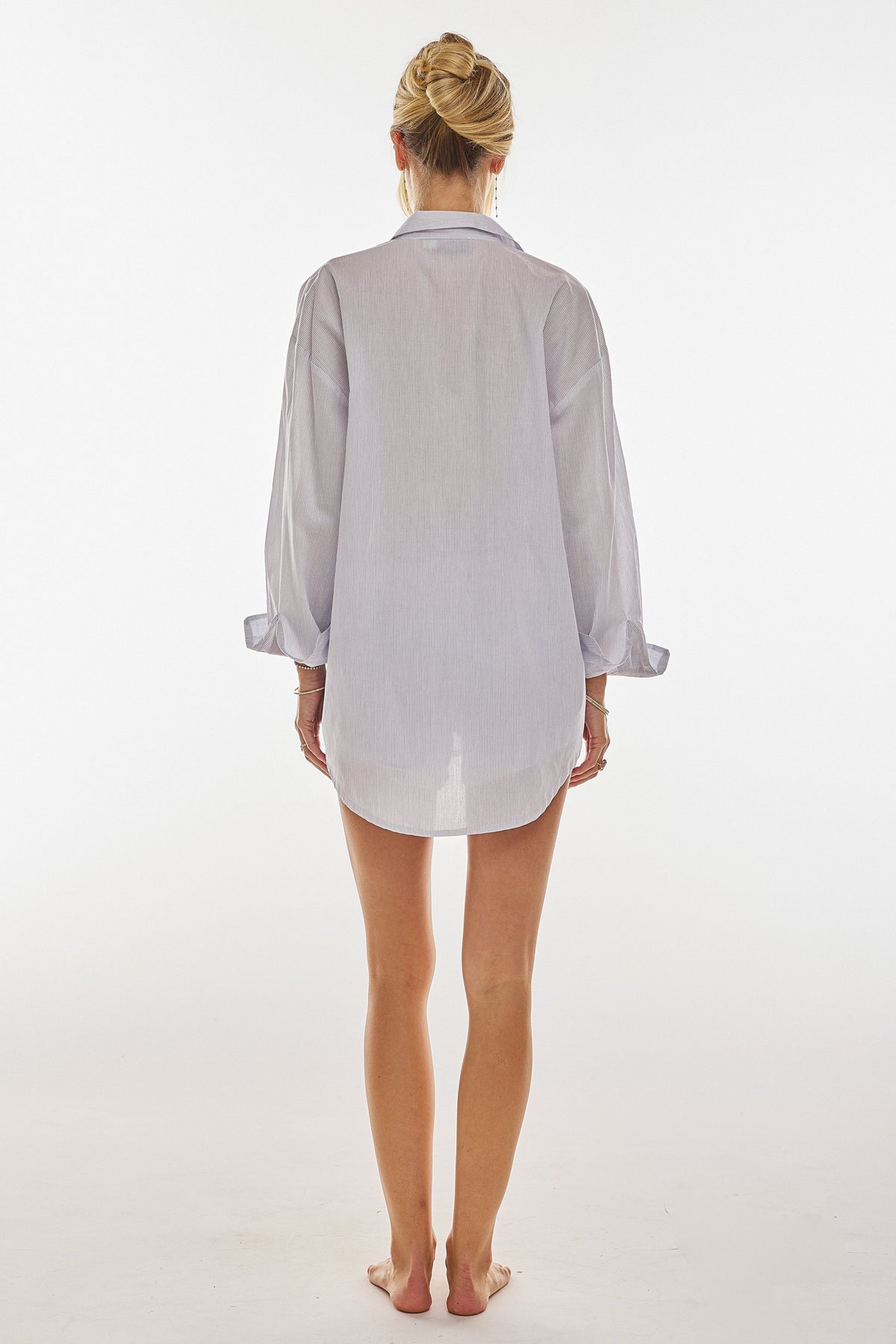 This is an image of Monica Blouse in Cloud - RESA featuring a model wearing the dress