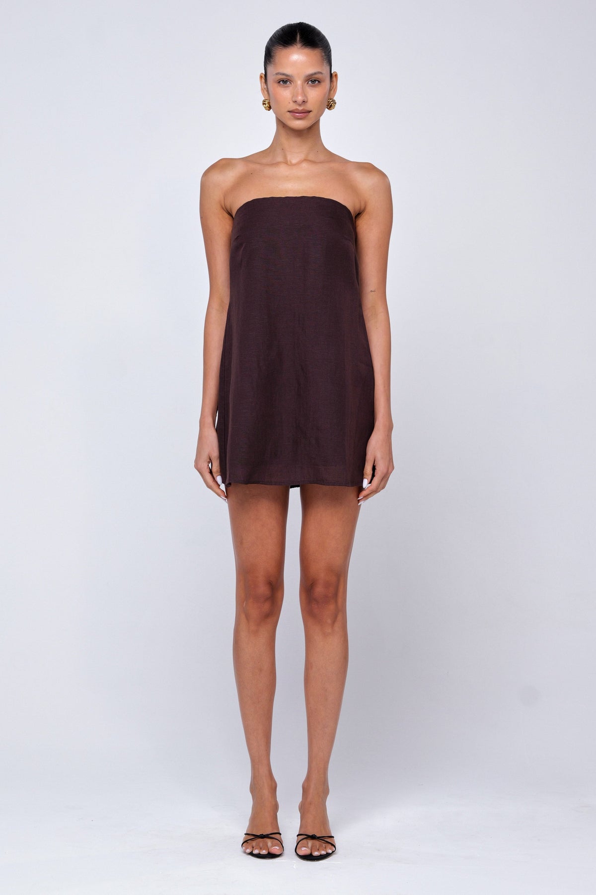 This is an image of Olive Mini Dress in Brown Linen - RESA featuring a model wearing the dress