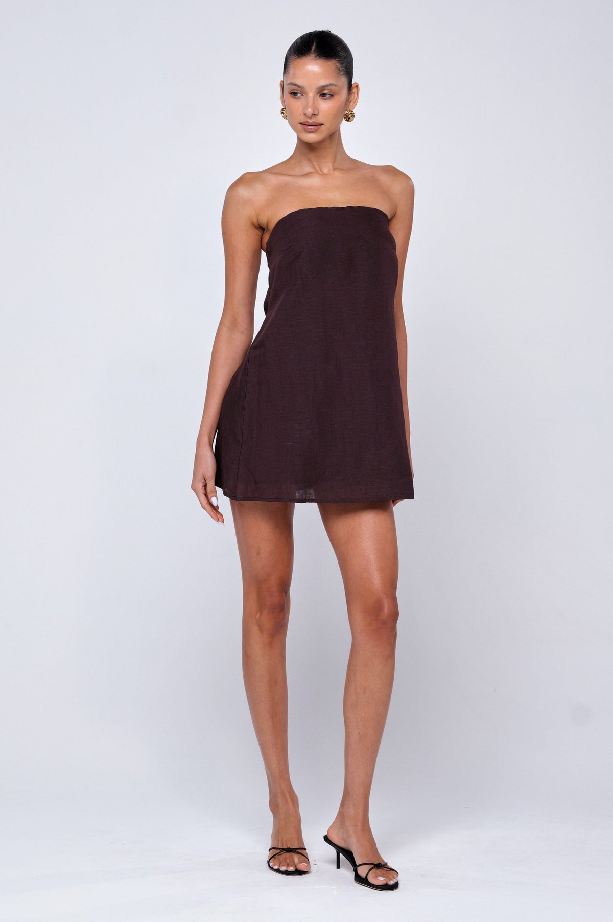 This is an image of Olive Mini Dress in Brown Linen - RESA featuring a model wearing the dress