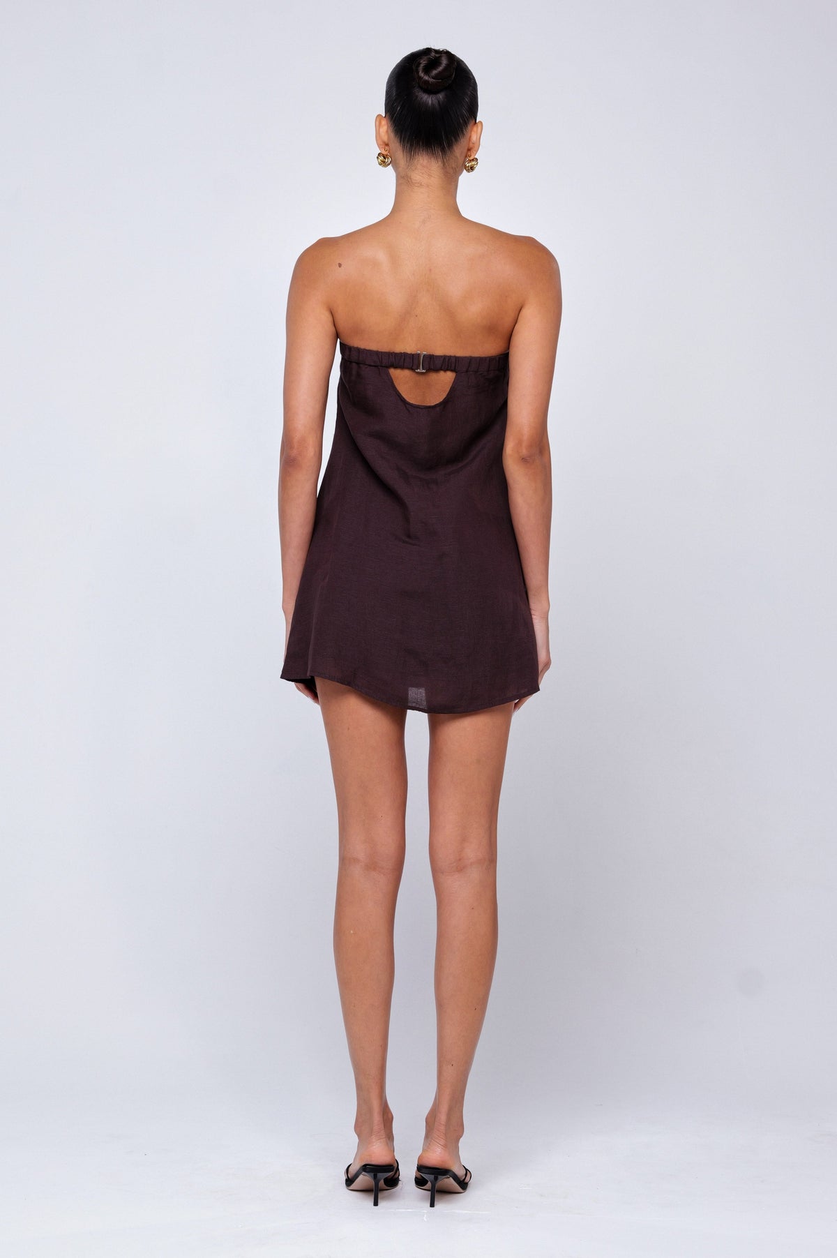 This is an image of Olive Mini Dress in Brown Linen - RESA featuring a model wearing the dress
