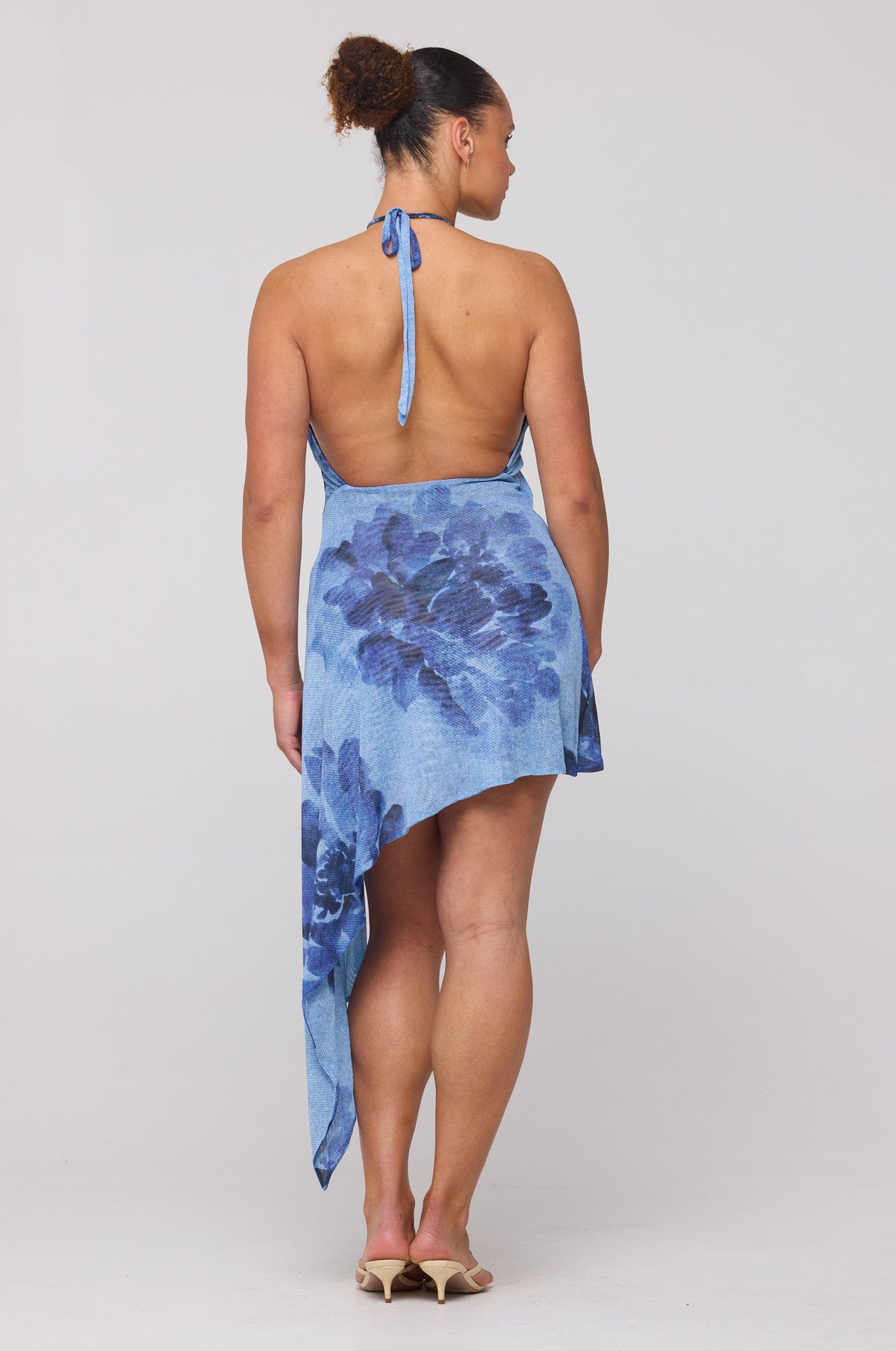 This is an image of Olivia Mini in Indigo - RESA featuring a model wearing the dress