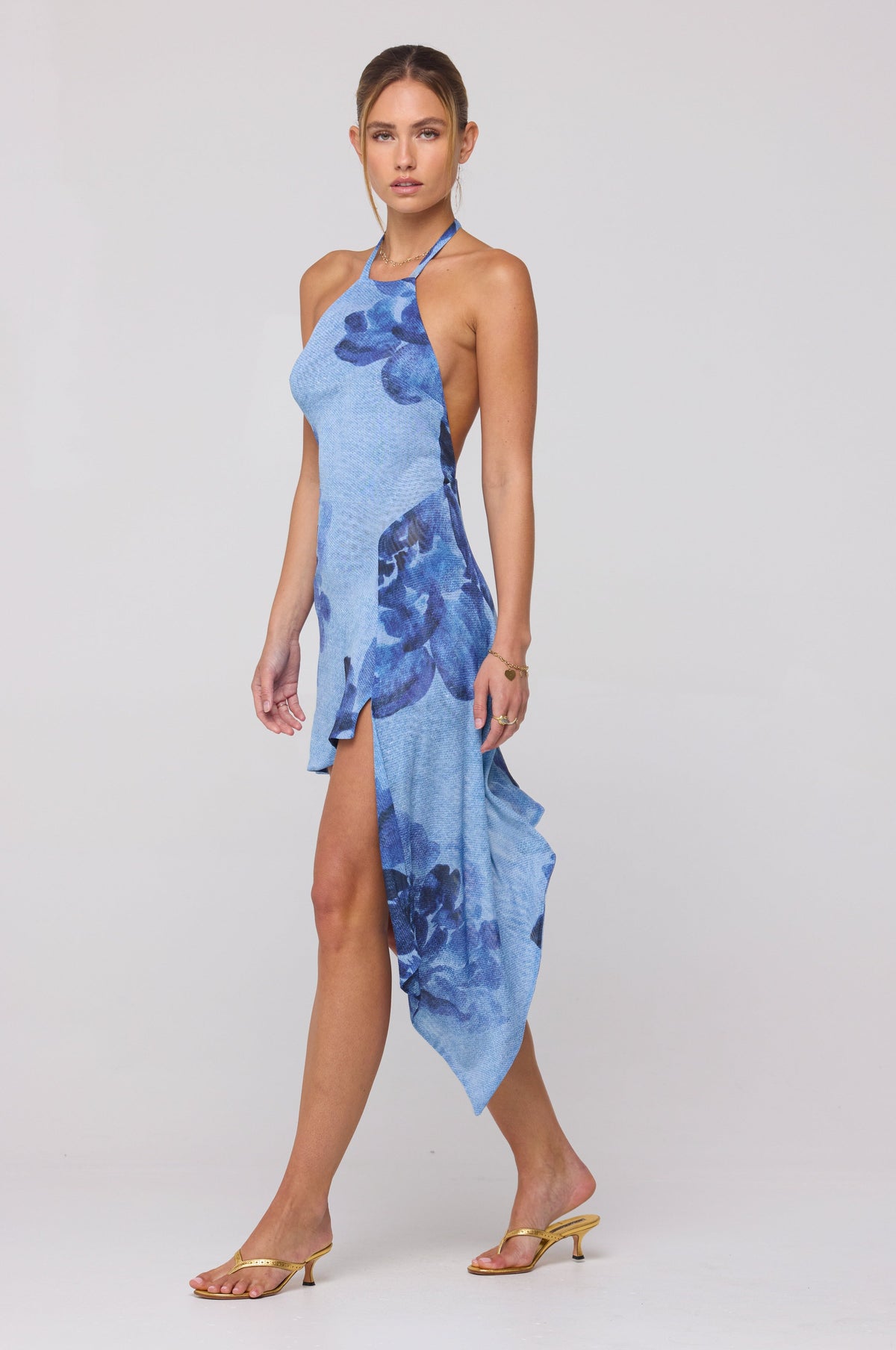 This is an image of Olivia Mini in Indigo - RESA featuring a model wearing the dress