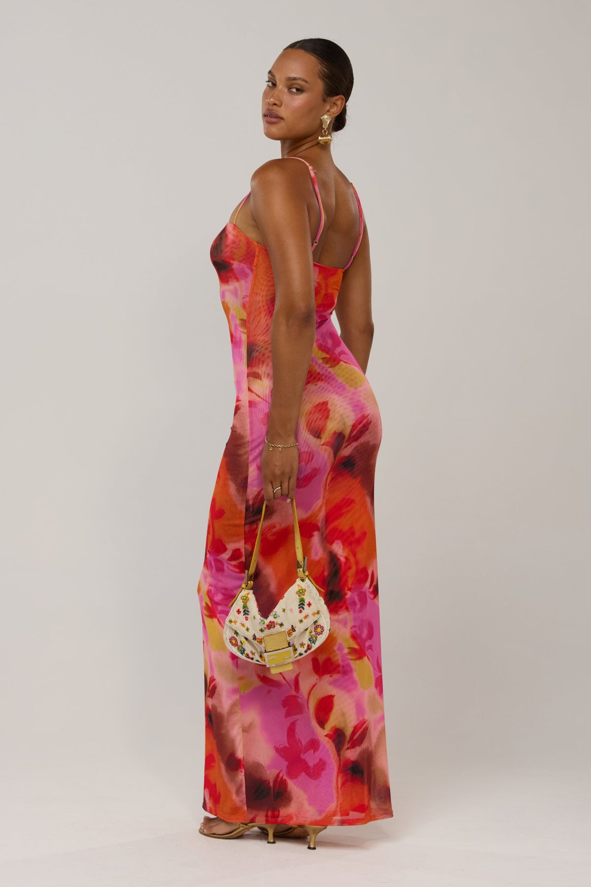 This is an image of Opal in Lilikoi - RESA featuring a model wearing the dress