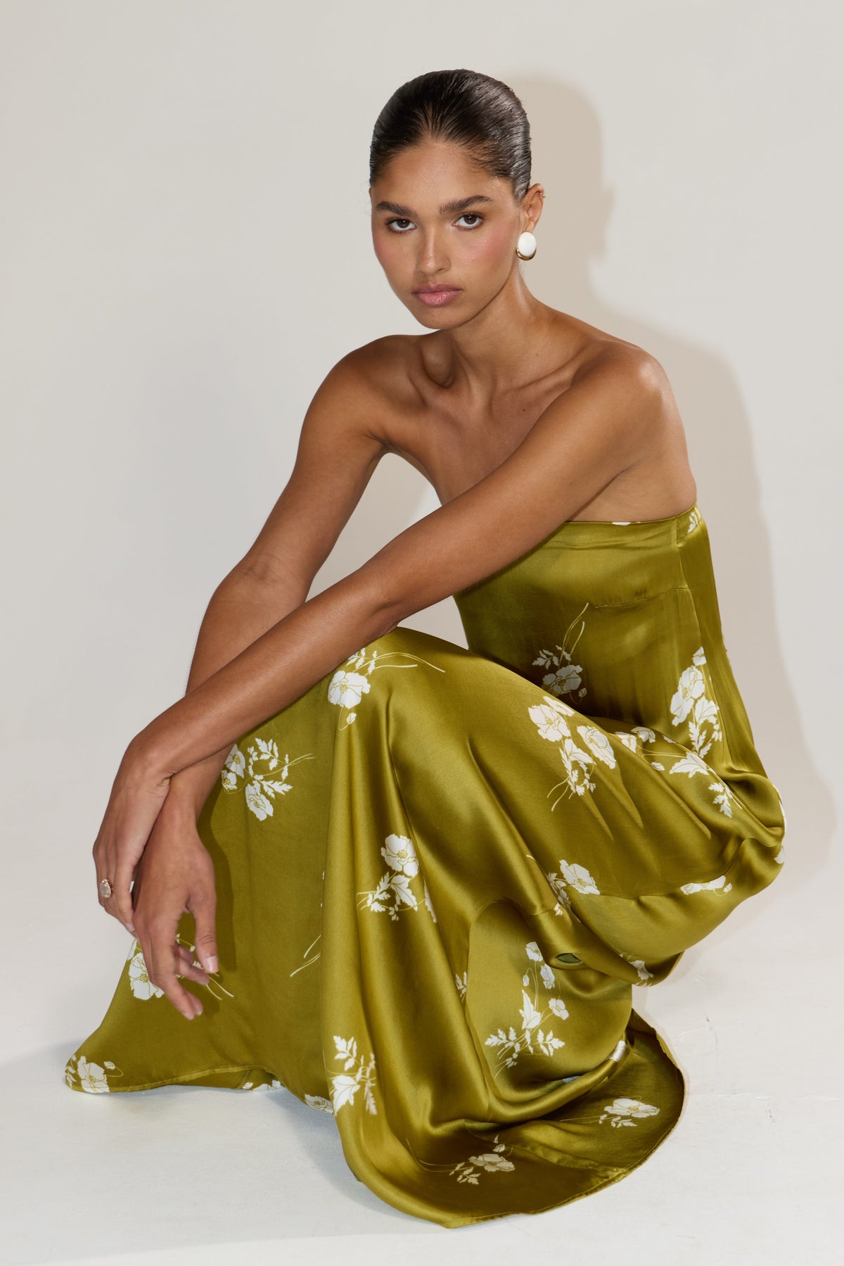 This is an image of Ophelia in Moss - RESA featuring a model wearing the dress
