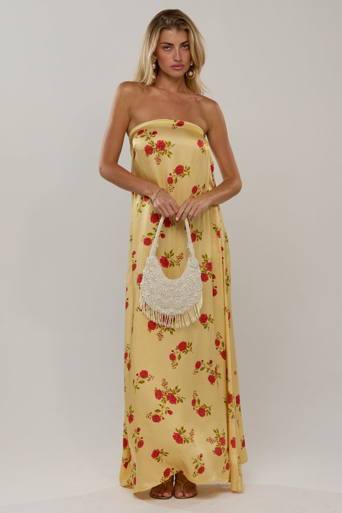This is an image of Ophelia in Saffron - RESA featuring a model wearing the dress