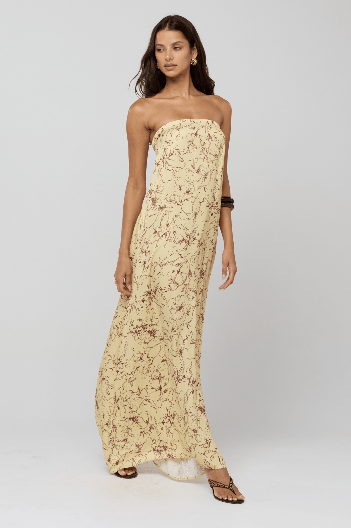 This is an image of Ophelia Maxi Dress in Butterscotch - RESA featuring a model wearing the dress
