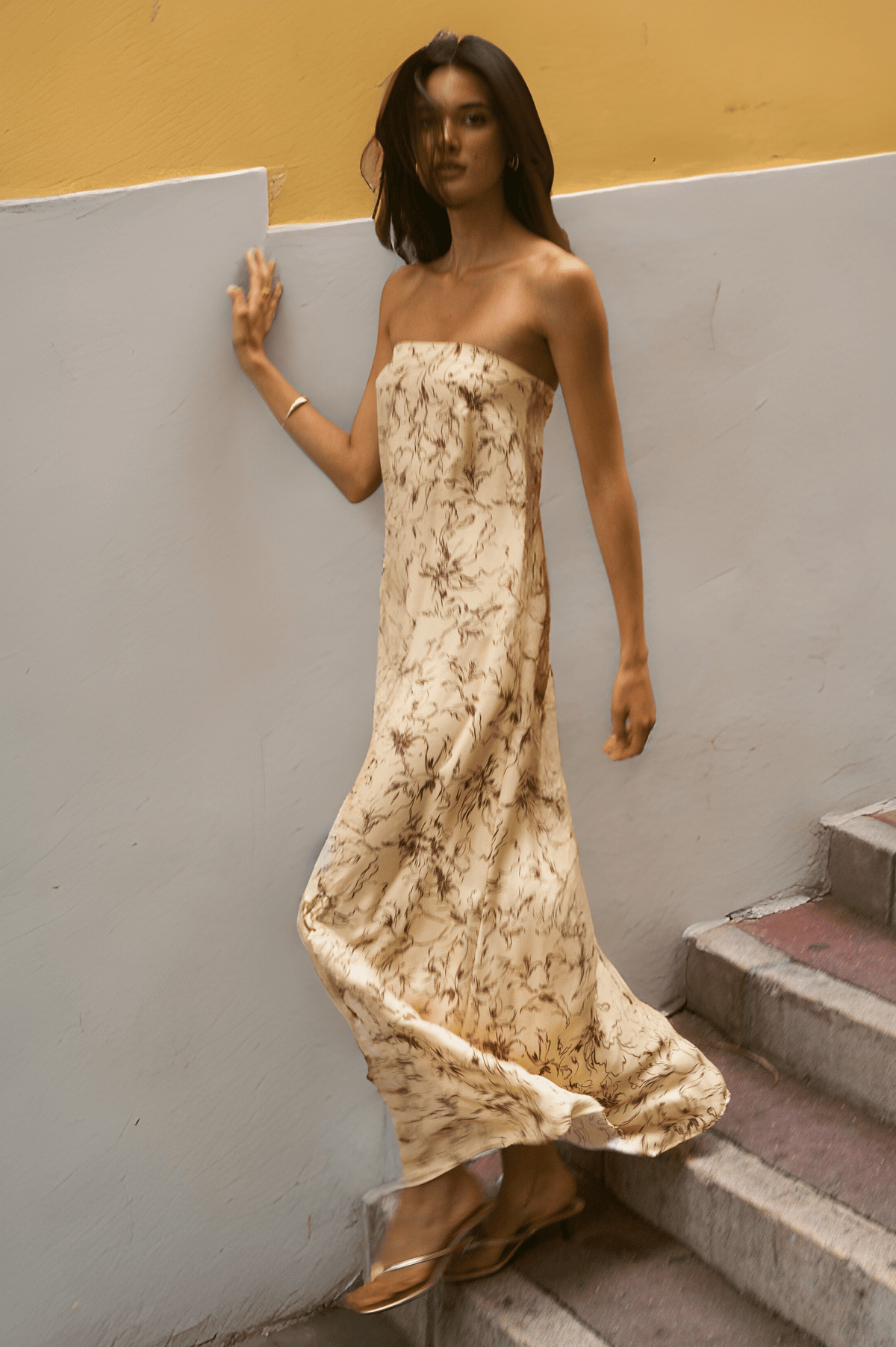 This is an image of Ophelia Maxi Dress in Butterscotch - RESA featuring a model wearing the dress
