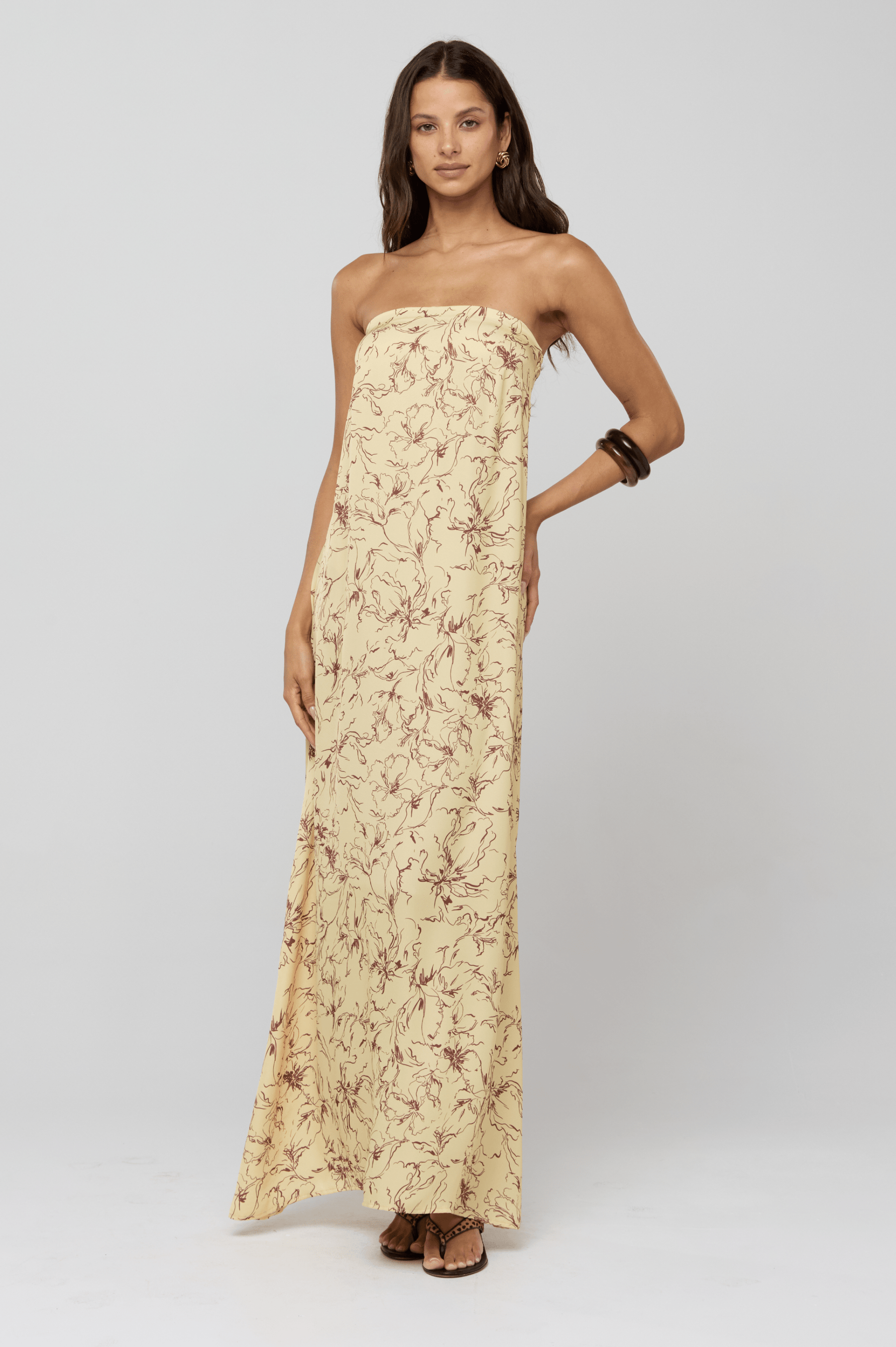 This is an image of Ophelia Maxi Dress in Butterscotch - RESA featuring a model wearing the dress