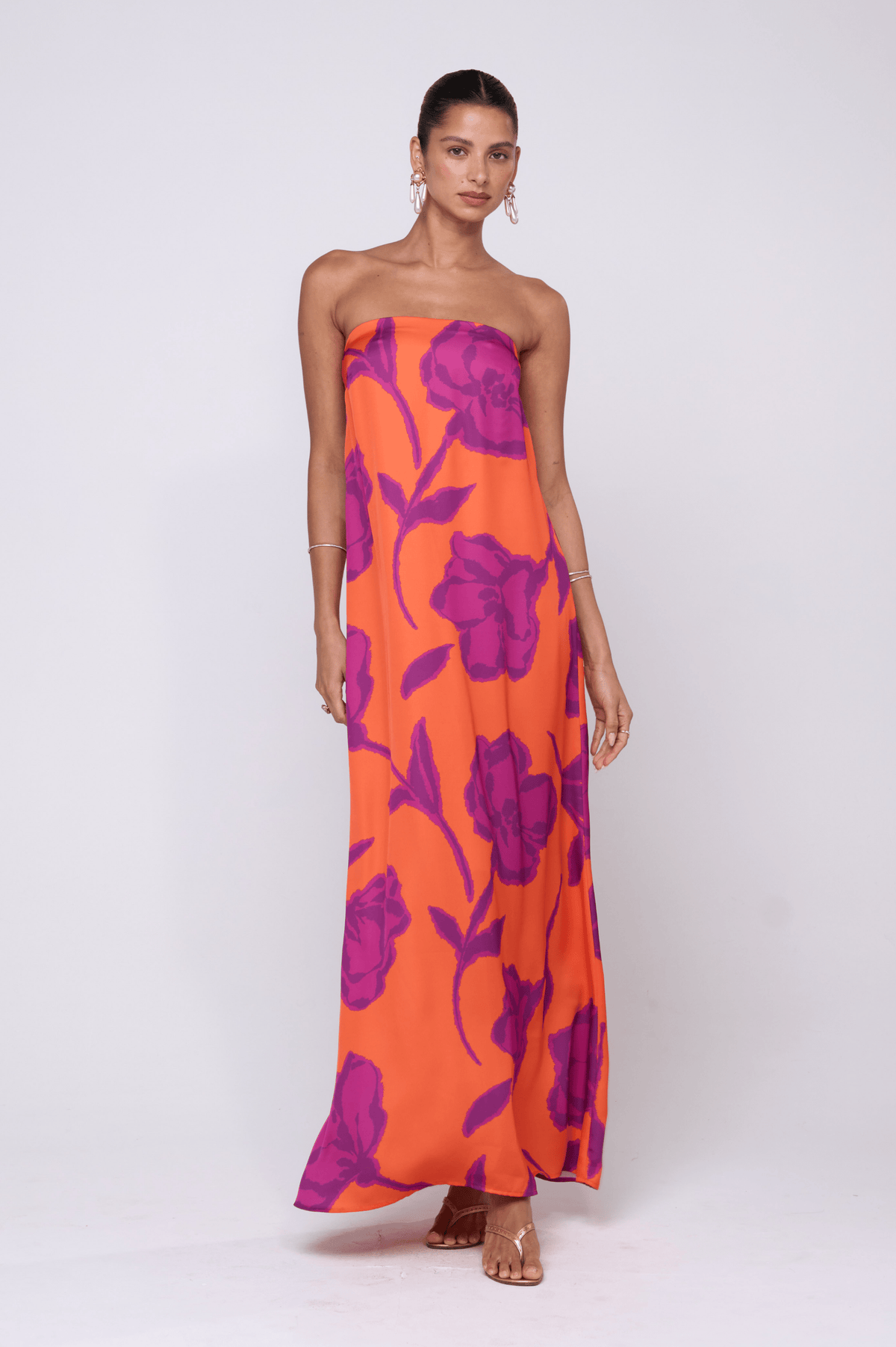 This is an image of Ophelia Maxi Dress in Mandarin - RESA featuring a model wearing the dress