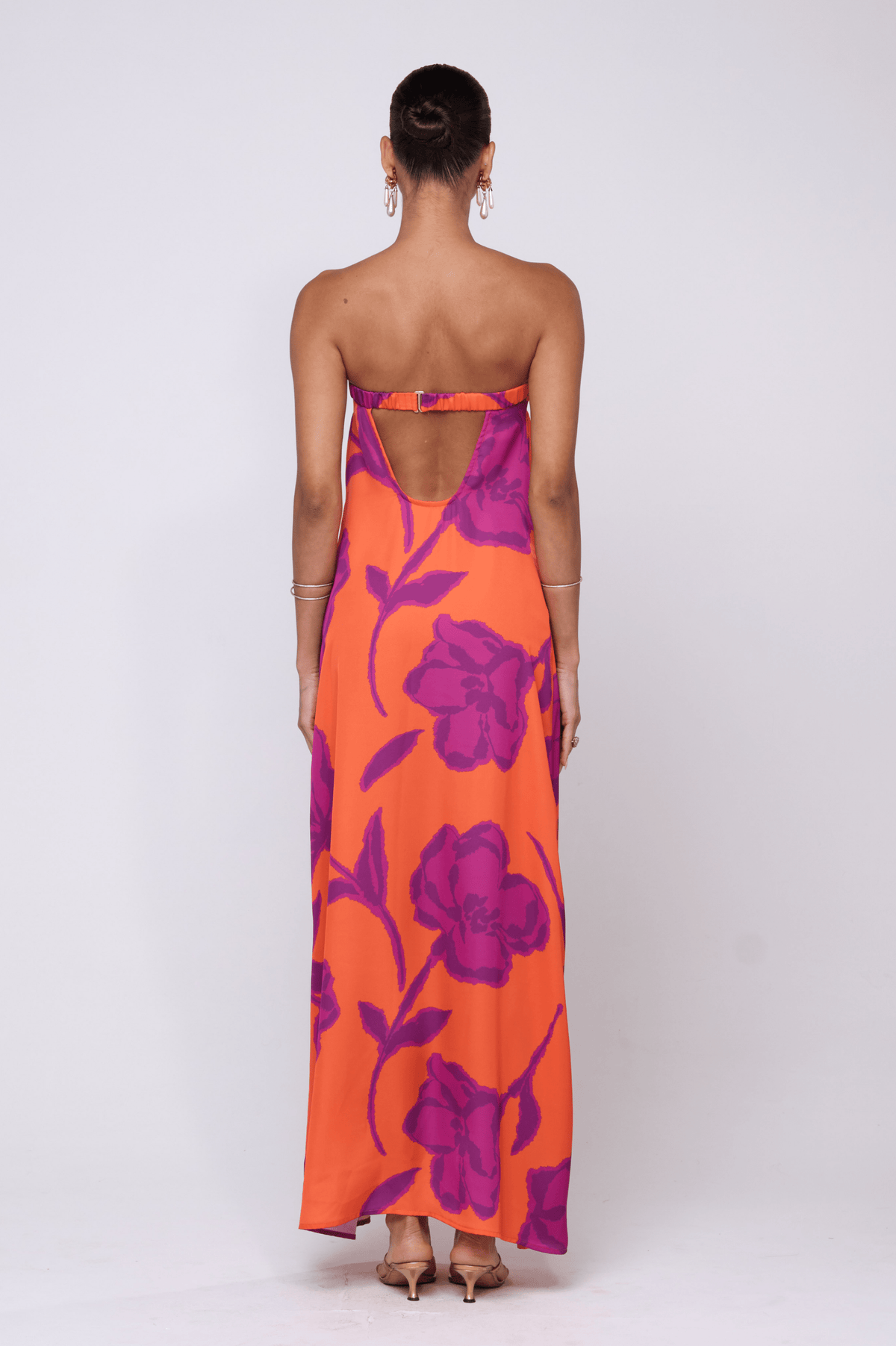 This is an image of Ophelia Maxi Dress in Mandarin - RESA featuring a model wearing the dress