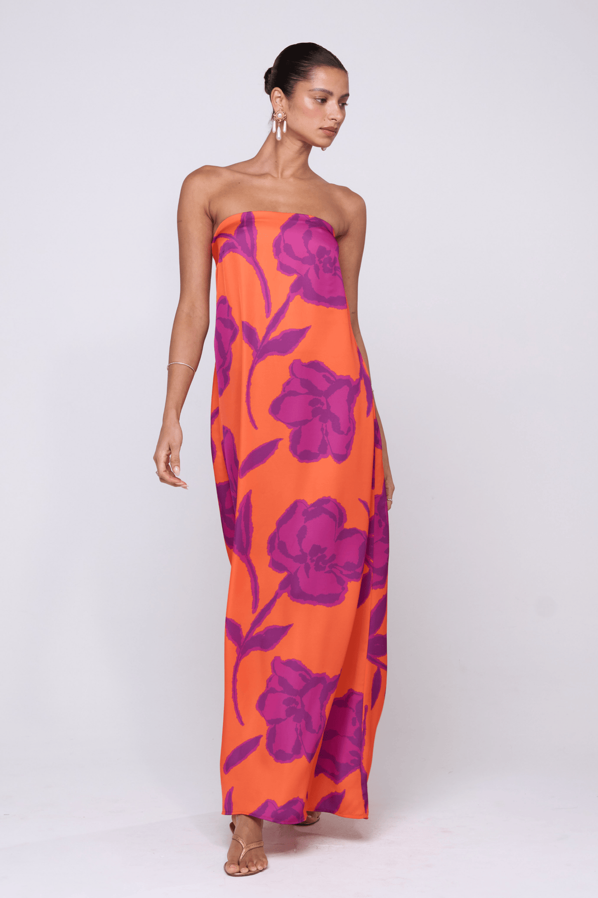 This is an image of Ophelia Maxi Dress in Mandarin - RESA featuring a model wearing the dress