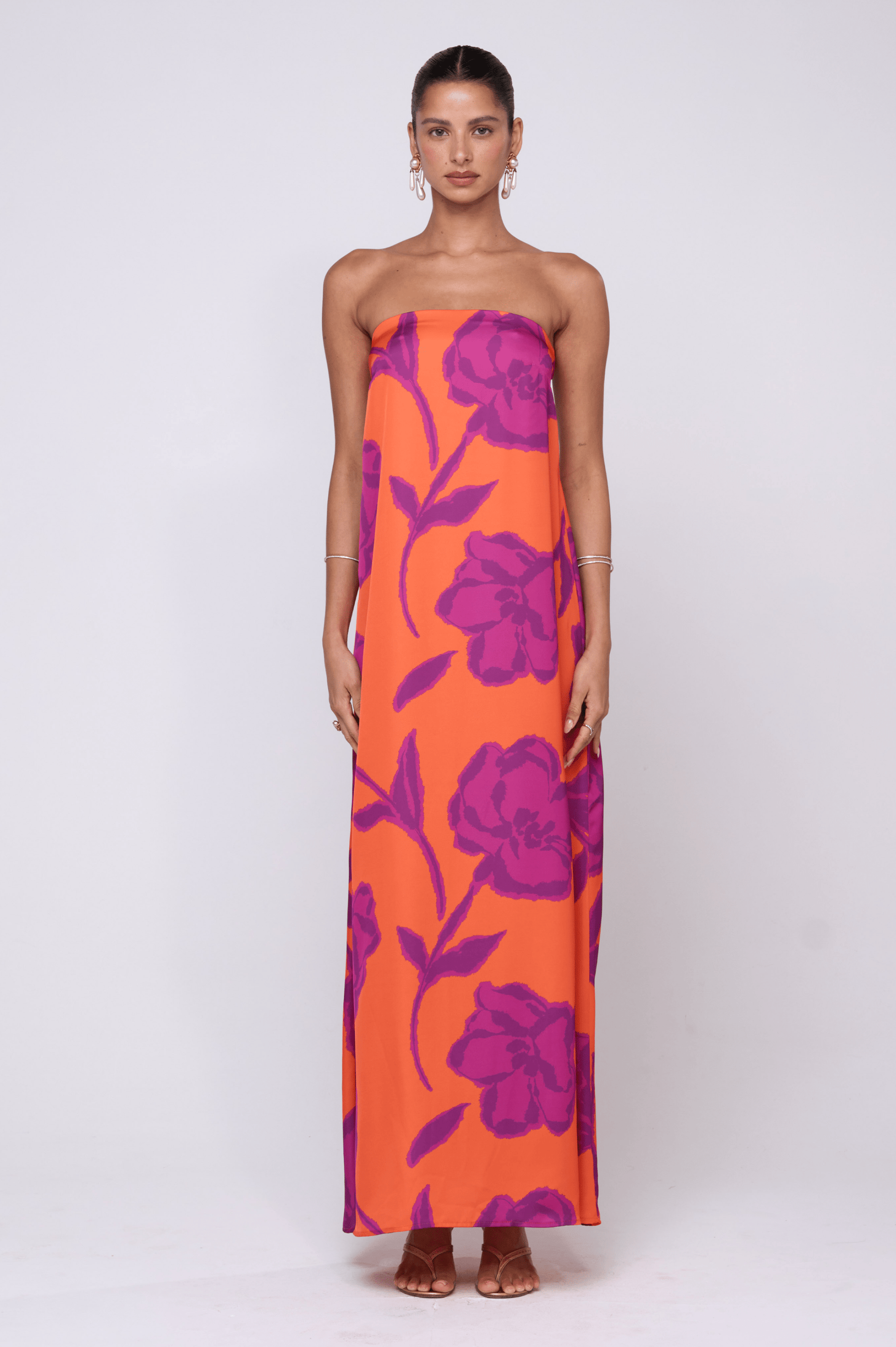 This is an image of Ophelia Maxi Dress in Mandarin - RESA featuring a model wearing the dress