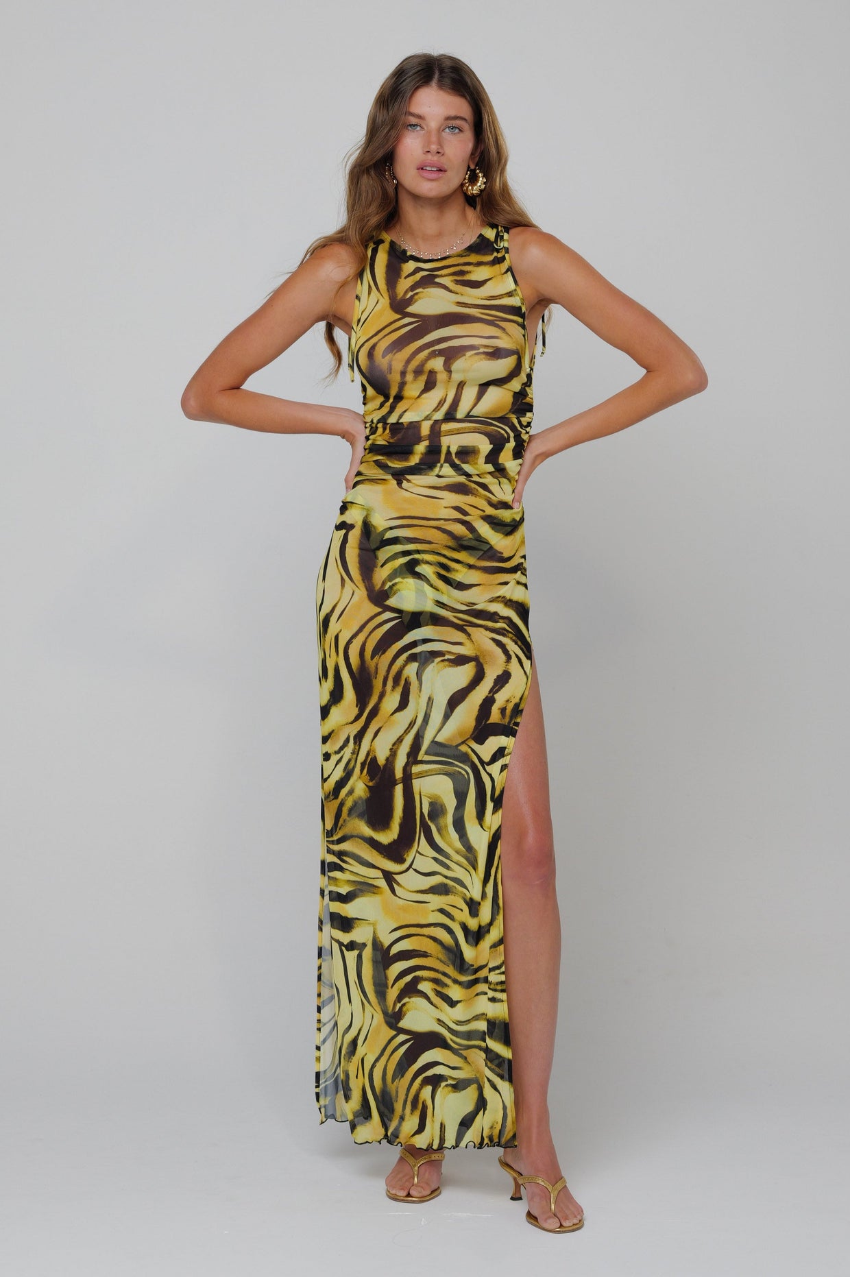 This is an image of Paige Dress in Lioness - RESA featuring a model wearing the dress